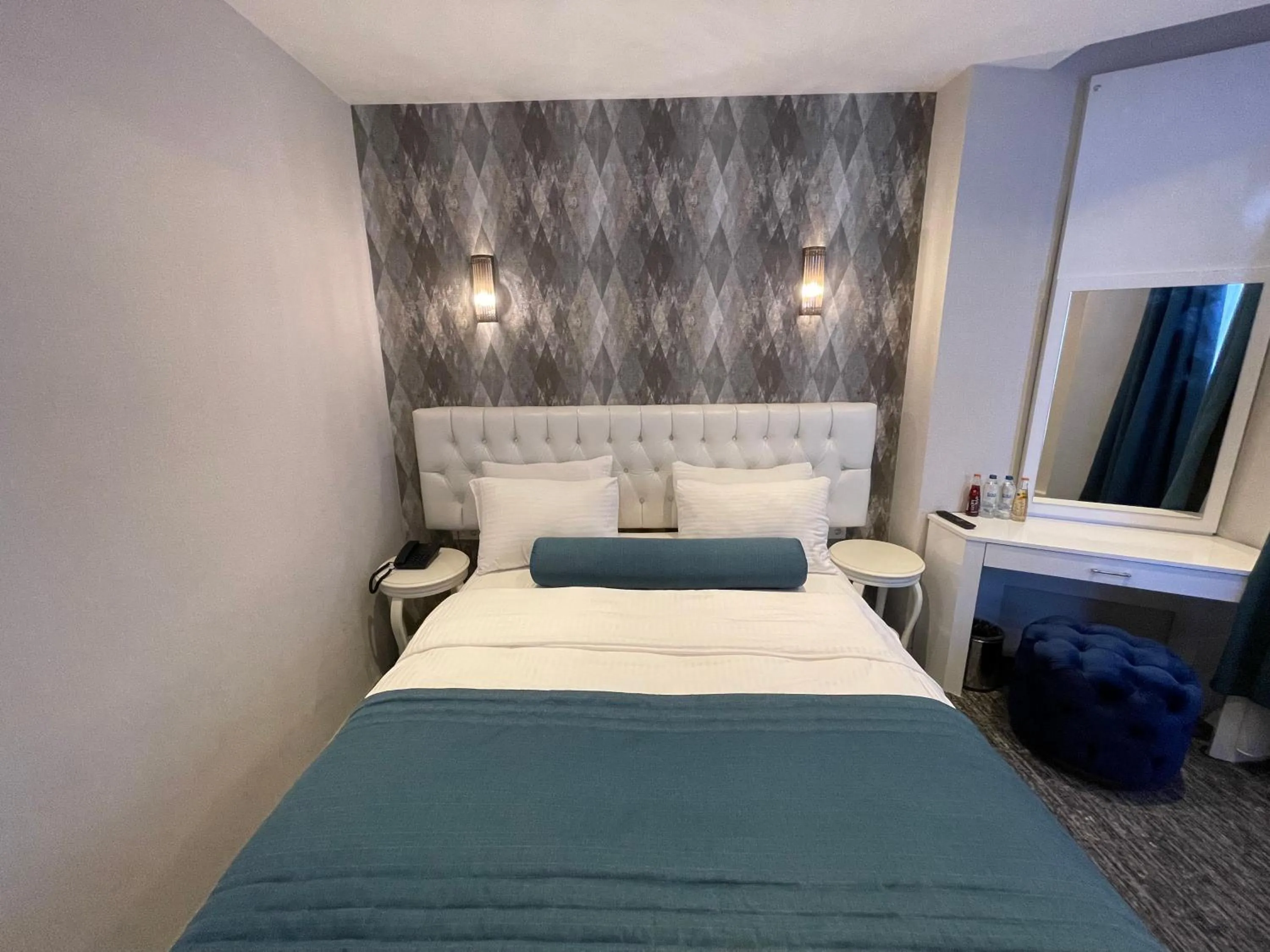 Bed in Mayfair Seaside Hotel