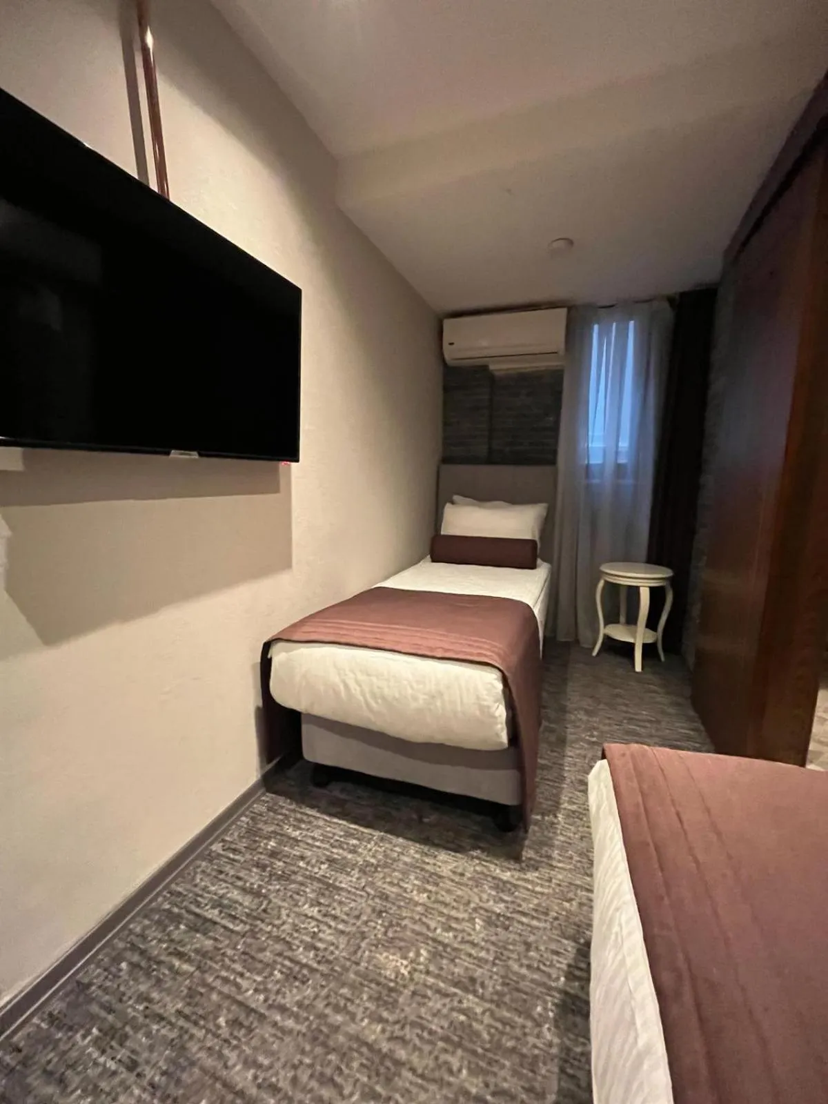 Bed in Mayfair Seaside Hotel