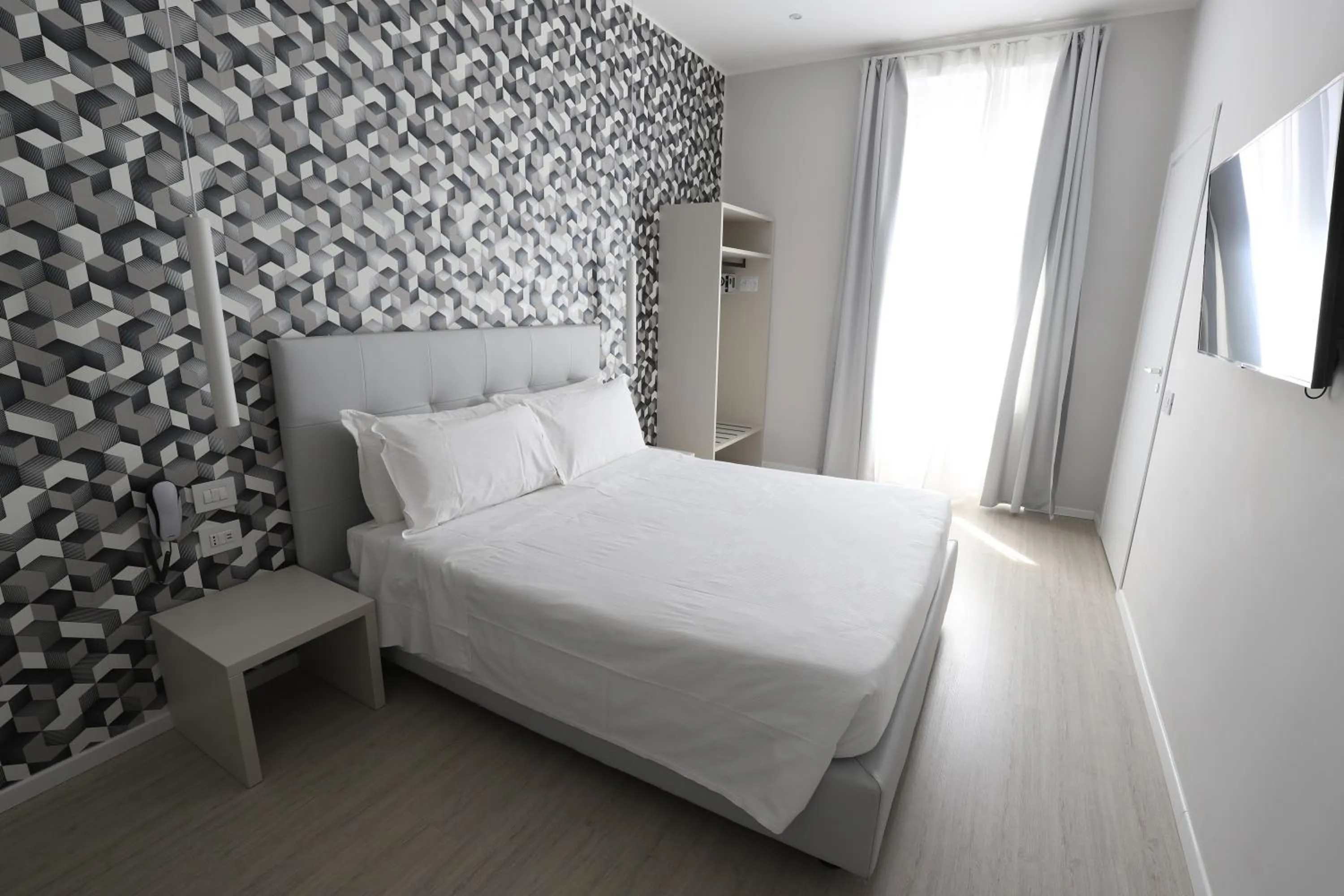 Bed in Cadorna Luxury Hotel