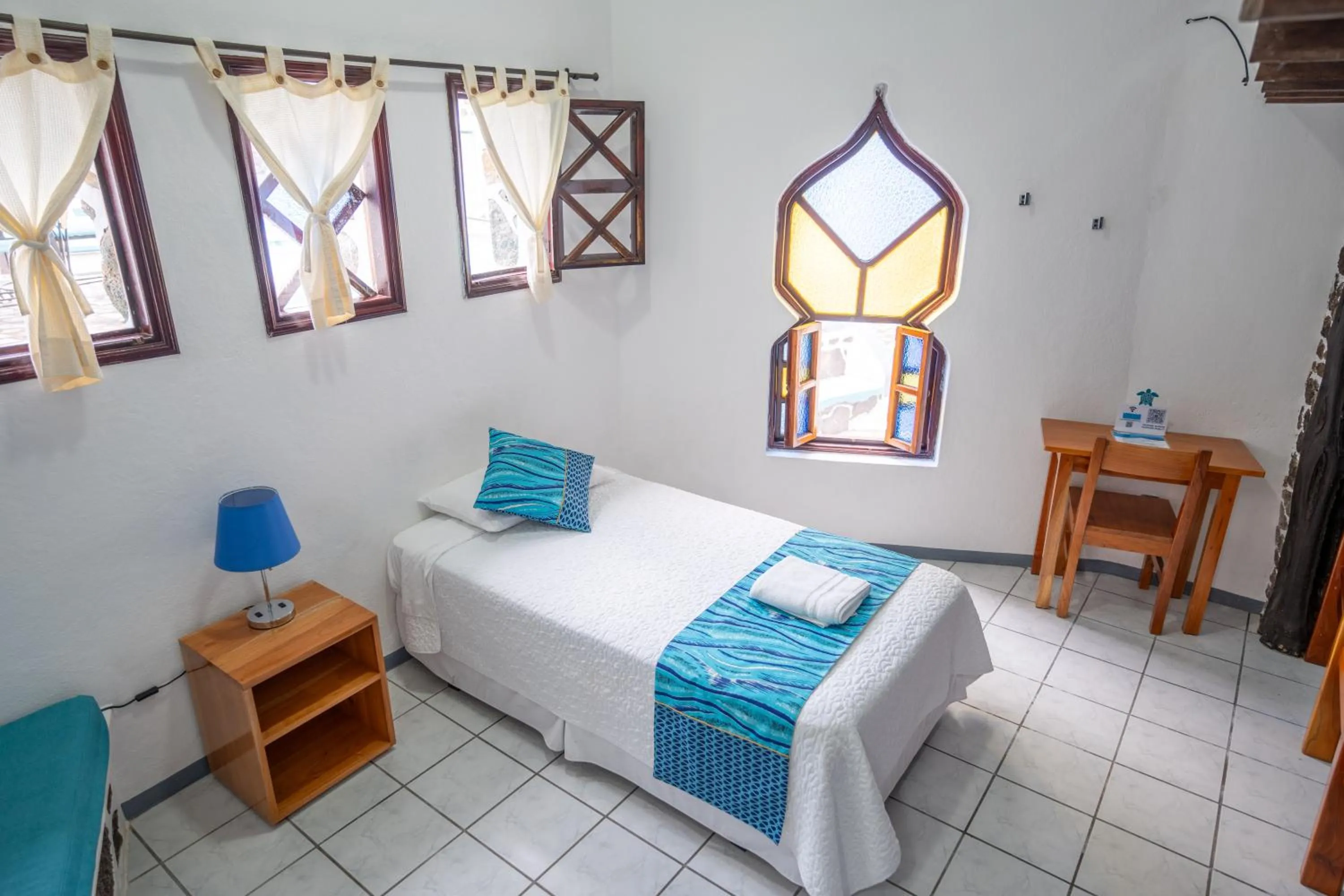 Bed in Maidith Galapagos Inn