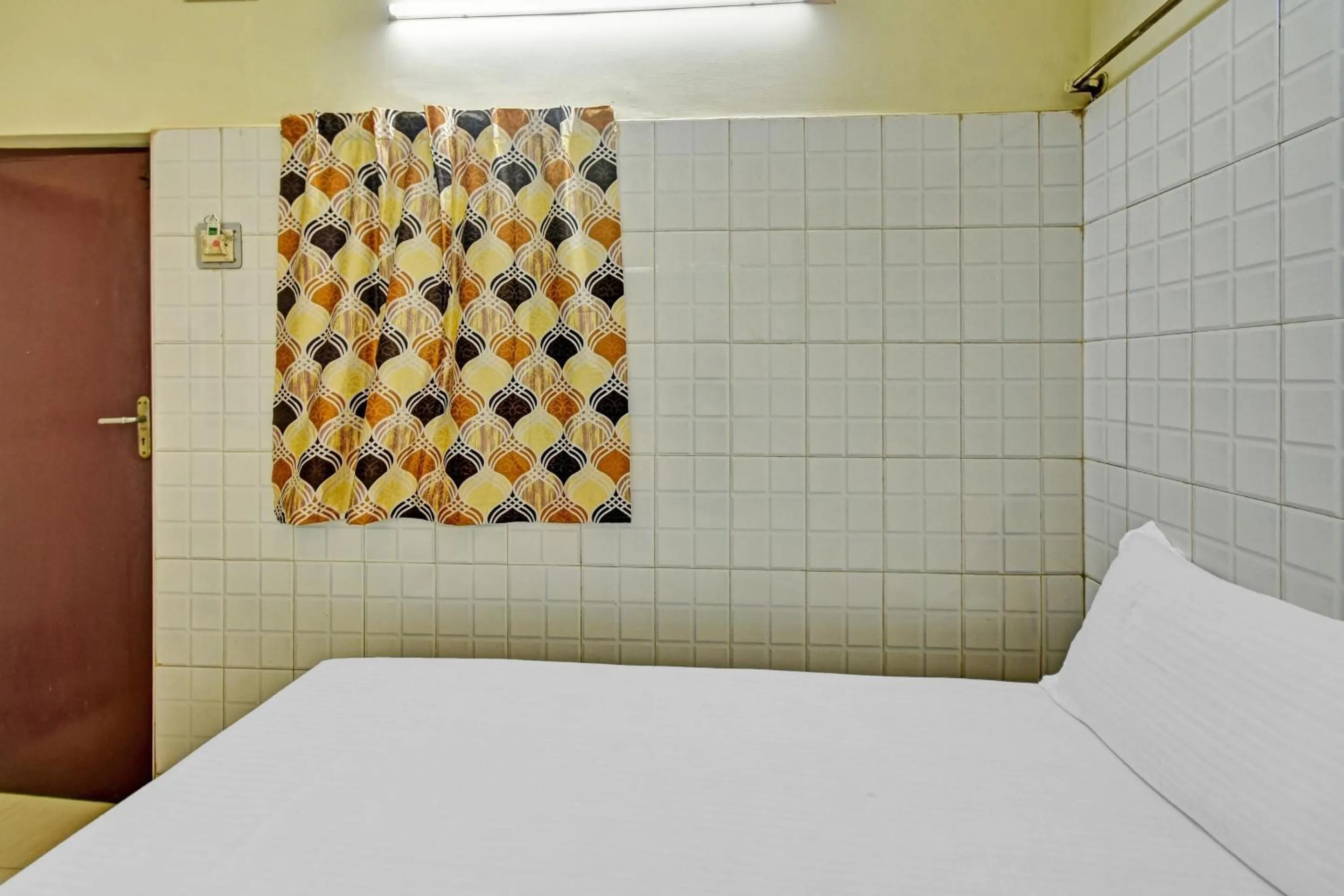 Bedroom in Hotel O Dream Palace Guest House Near Marina Beach