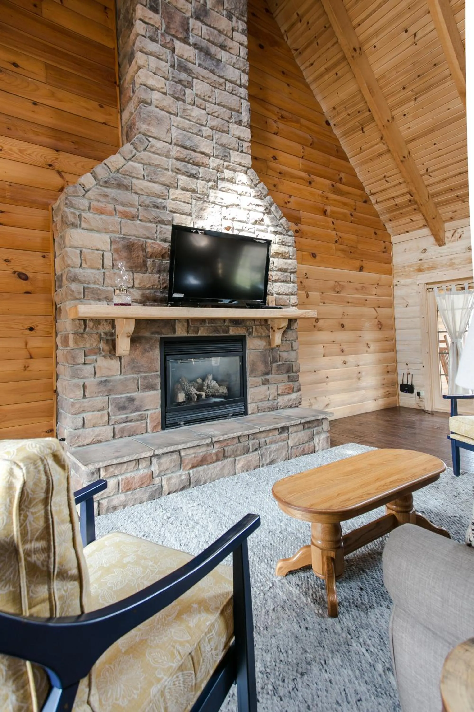 Living room in Blue Jays Nest Cabin by Amish Country Lodging