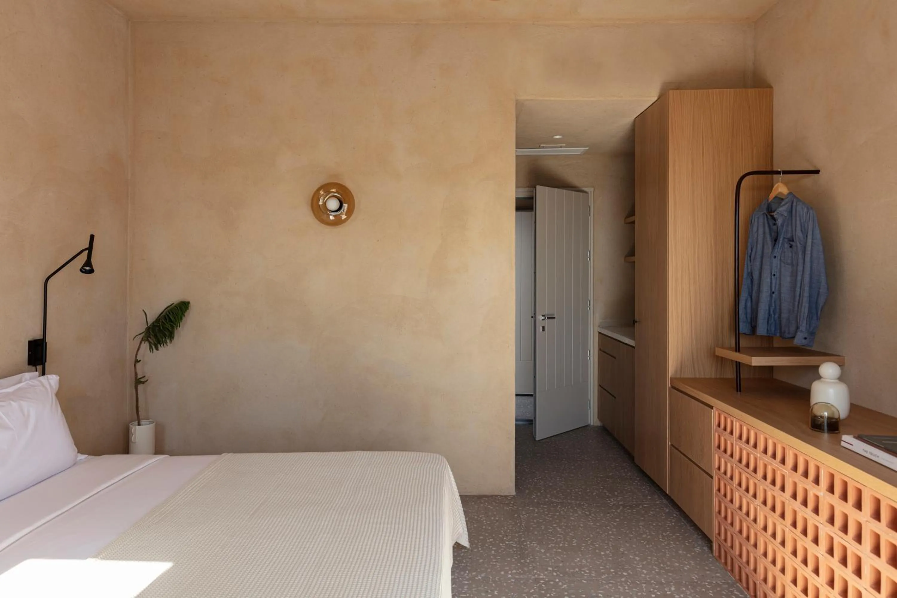 Bed in Ethos Vegan Suites Fira, Santorini