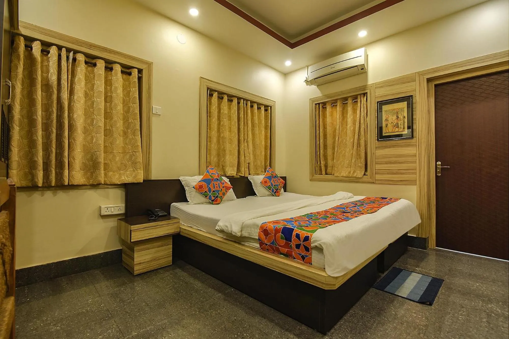 Bed in FabHotel Shivalya