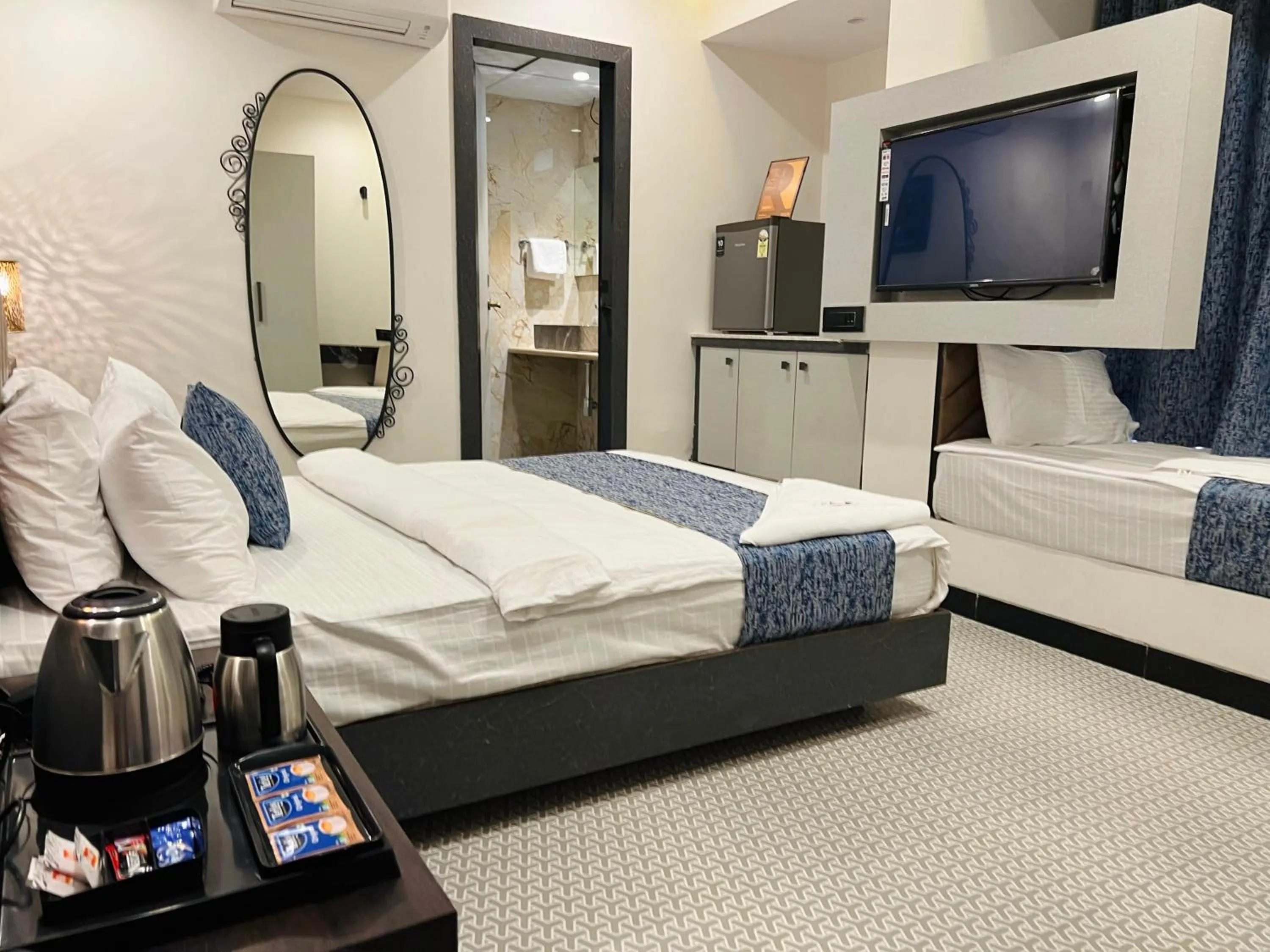 Bed in Rich Hotel Mumbai