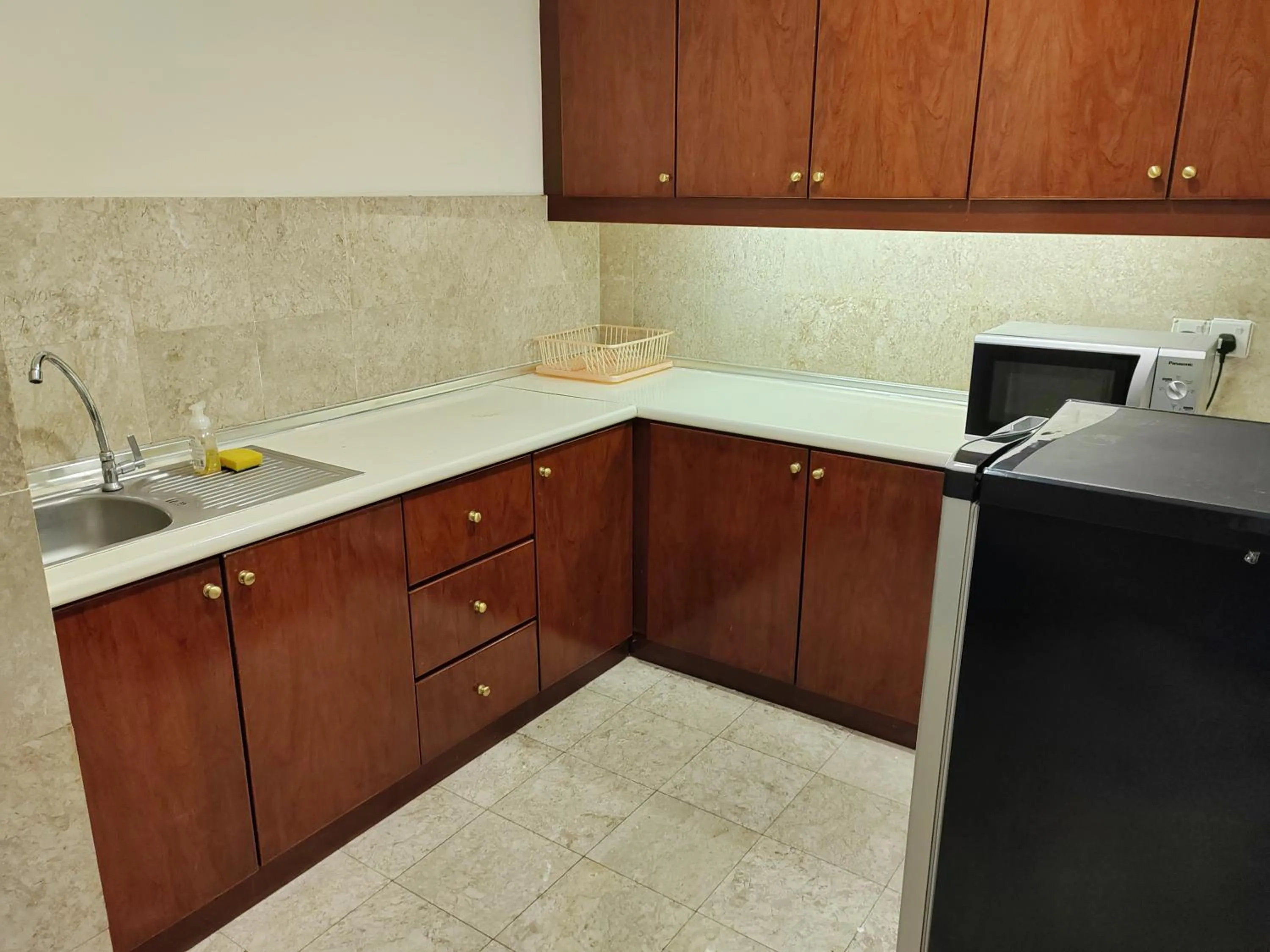 Kitchen or kitchenette in Kl landmark apartment at berjay Times square