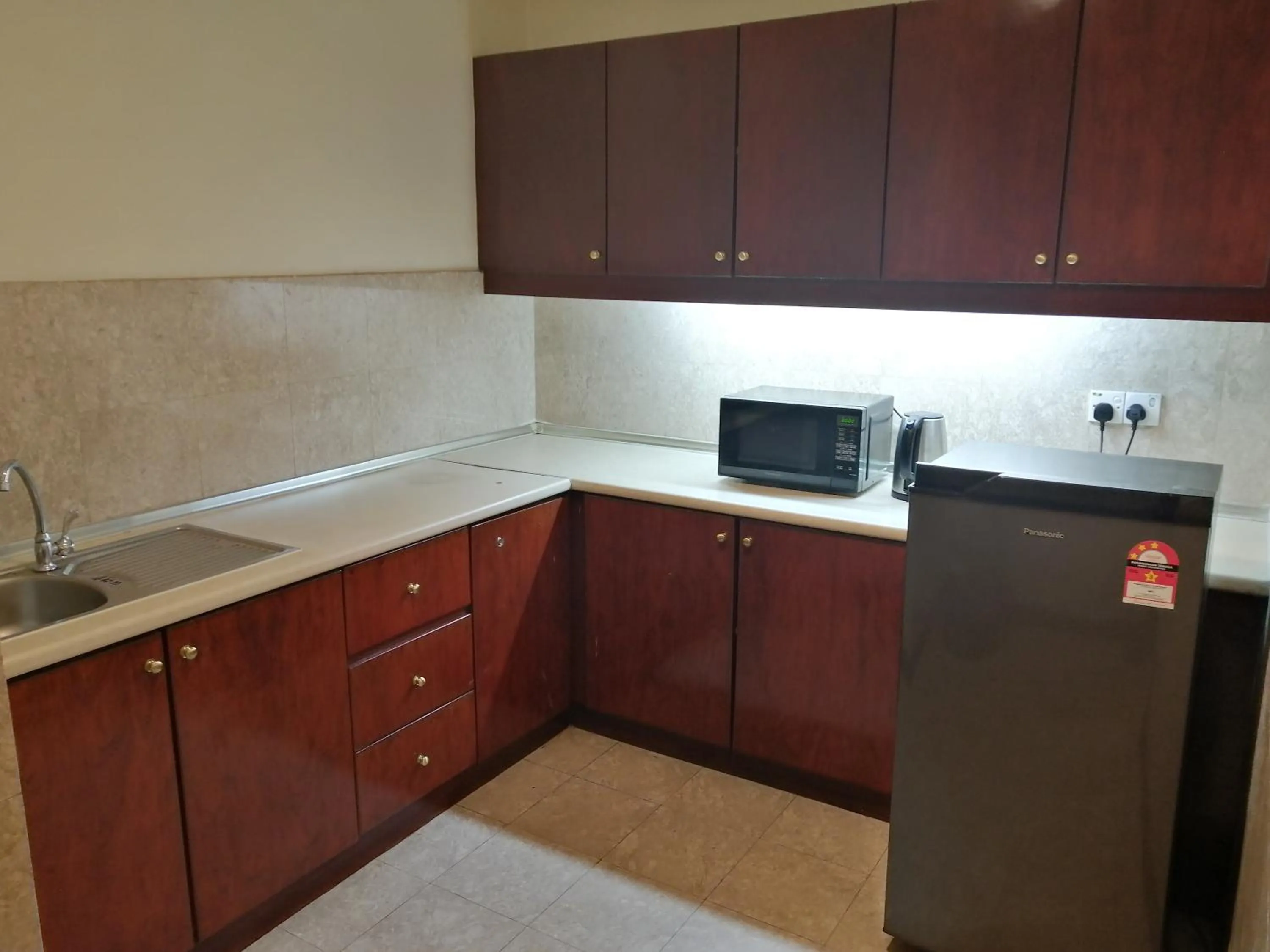 Kitchen or kitchenette in Kl landmark apartment at berjay Times square