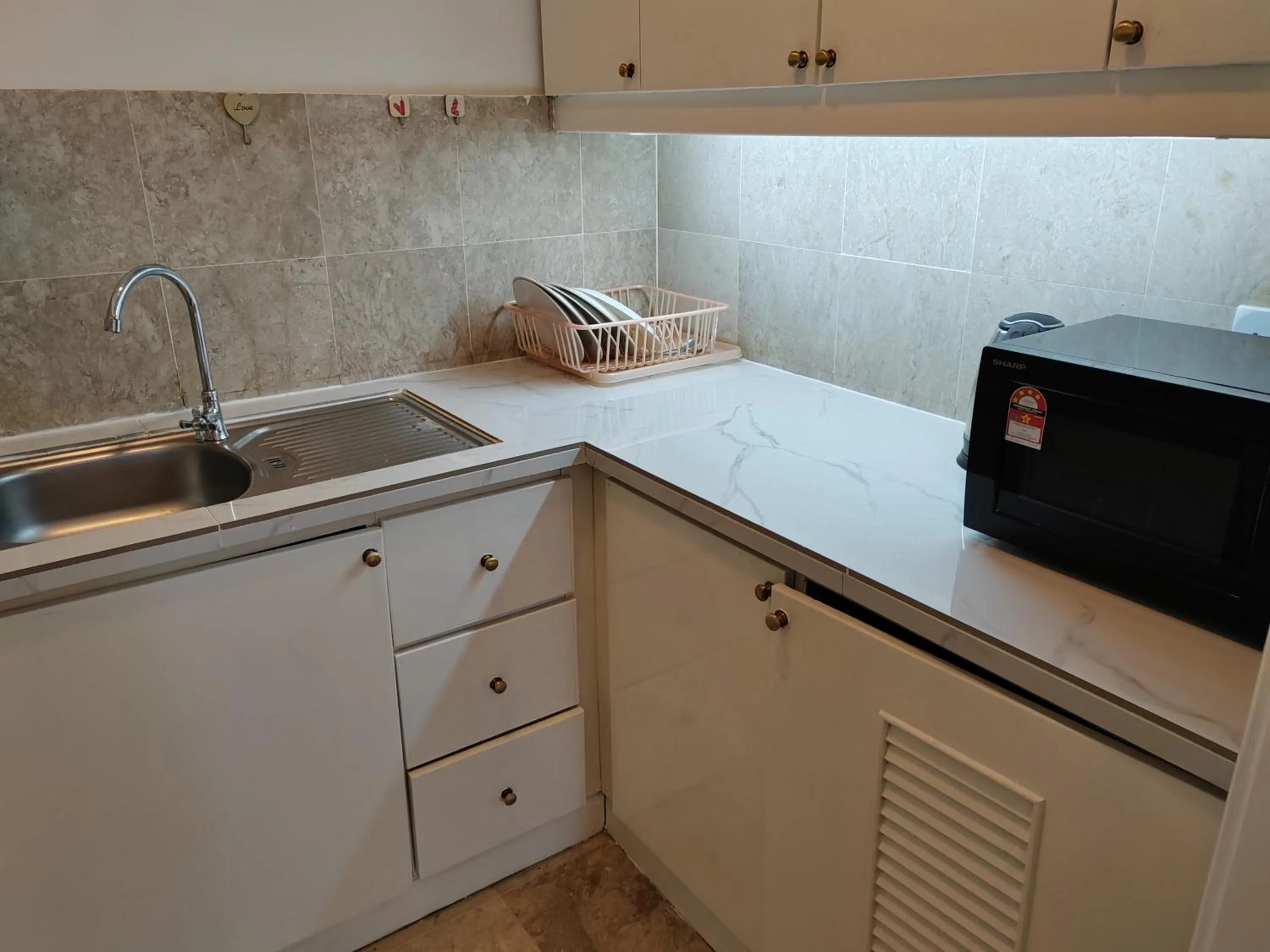 Kitchen or kitchenette in Kl landmark apartment at berjay Times square