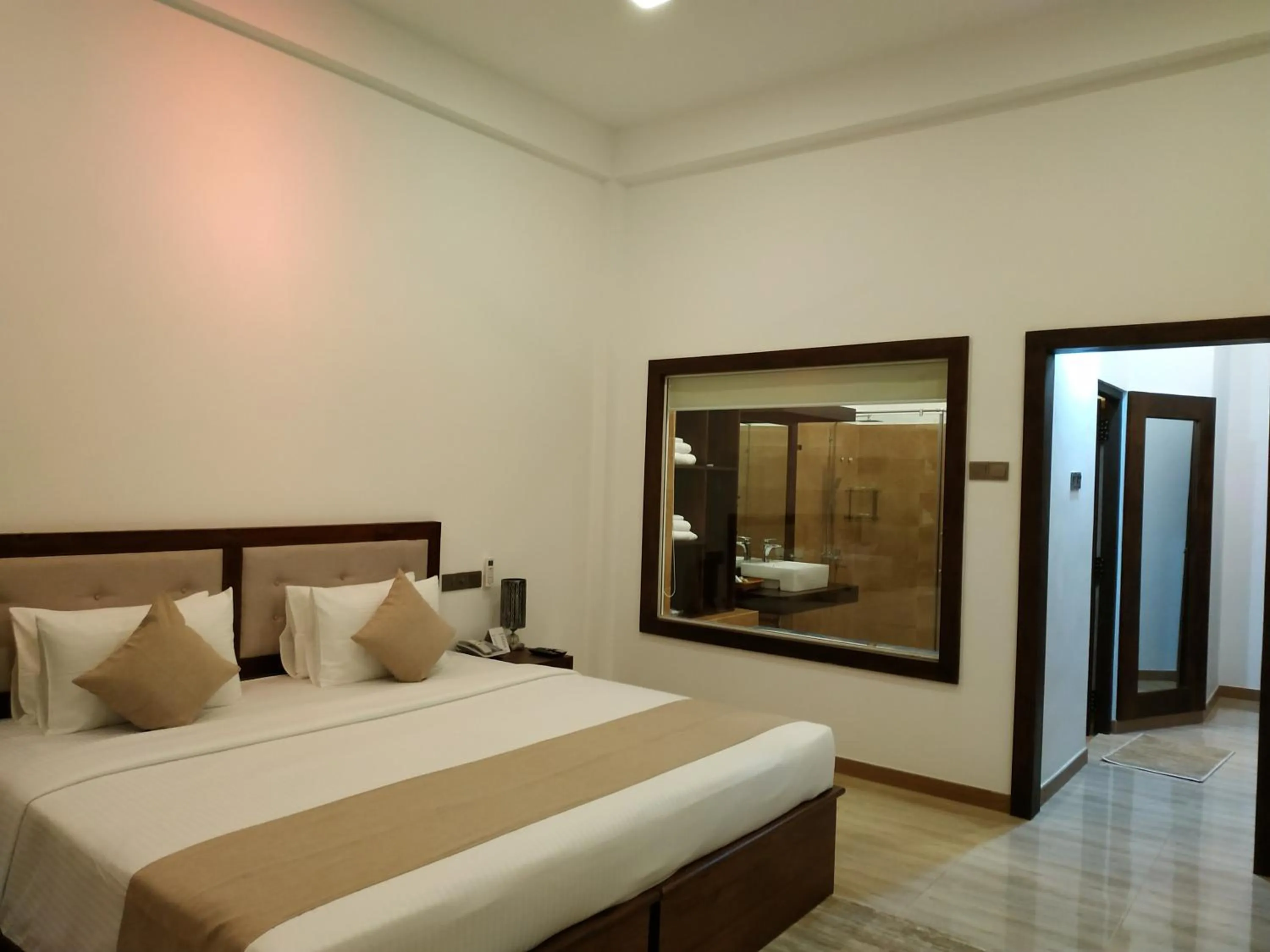 Bed in Sigiriya Cashew Palace Resort