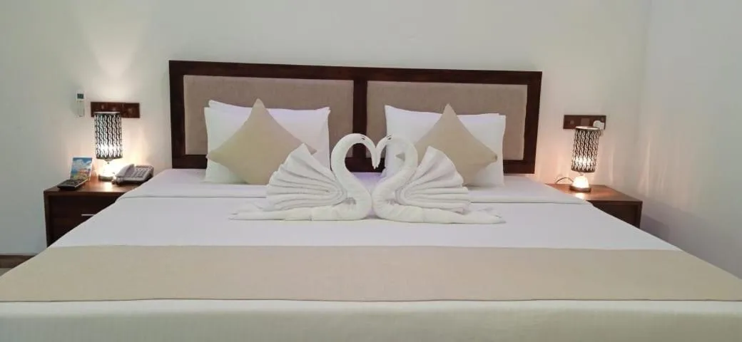 Bed in Sigiriya Cashew Palace Resort