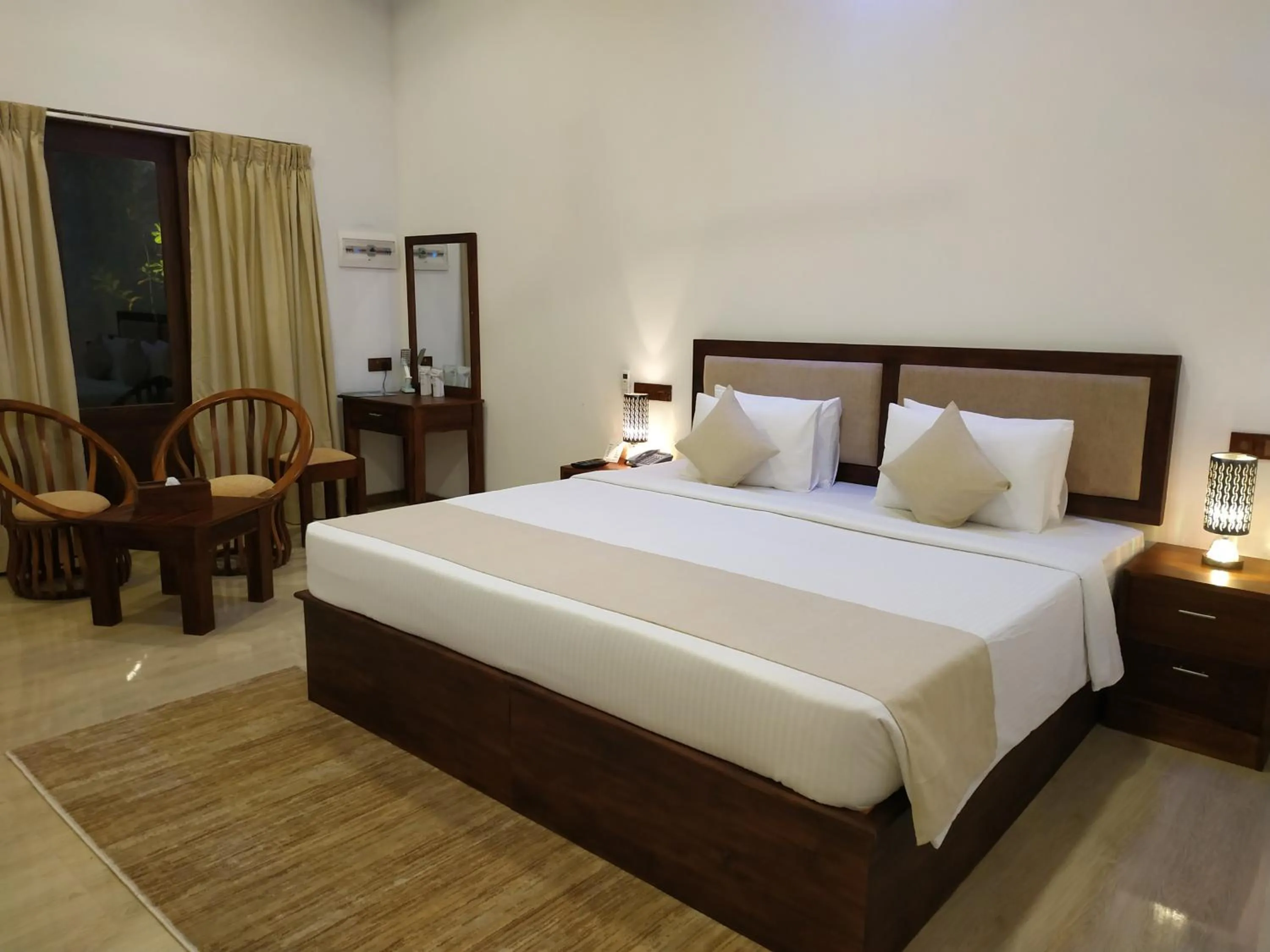 Bed in Sigiriya Cashew Palace Resort