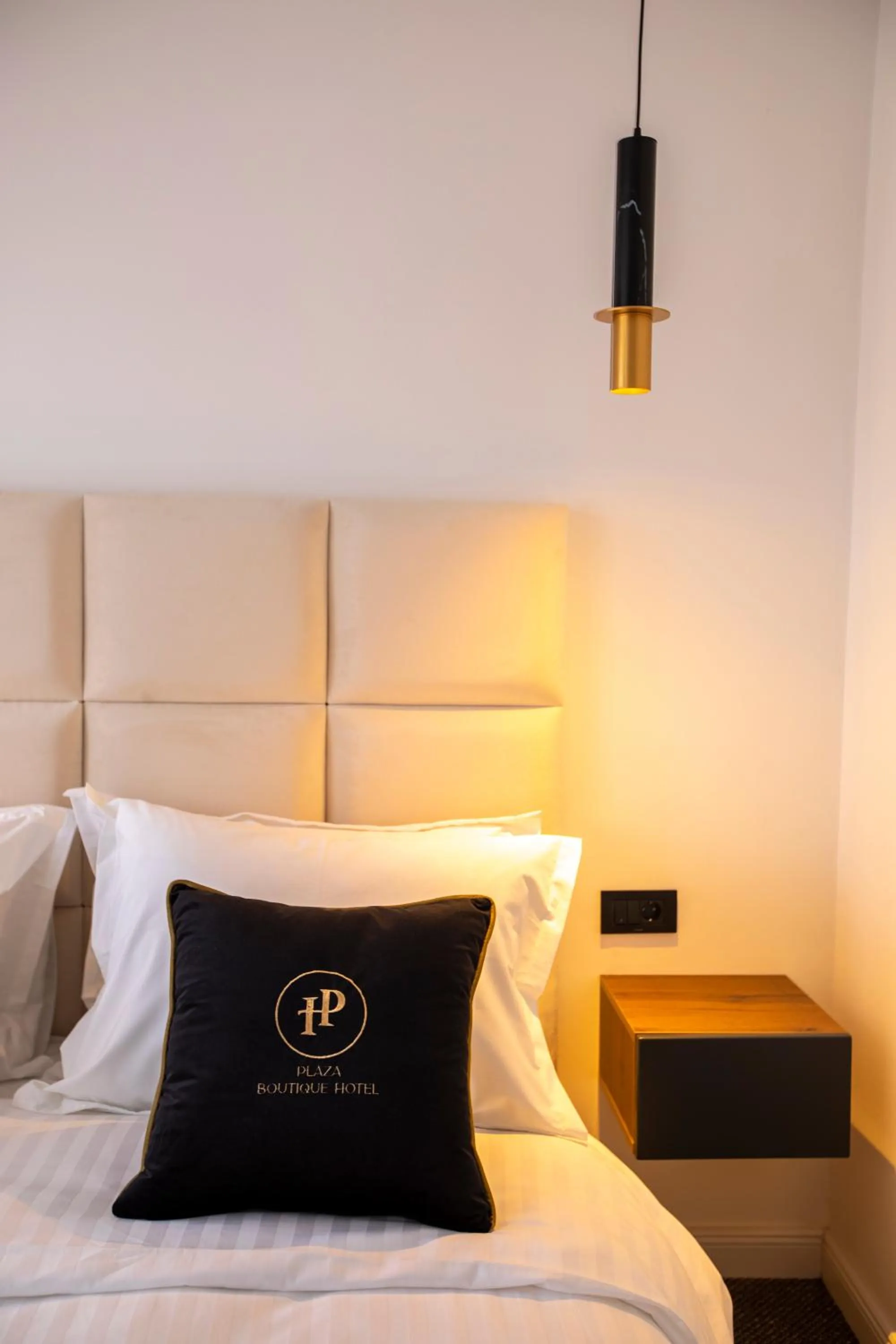 Bed in Plaza Boutique Hotel