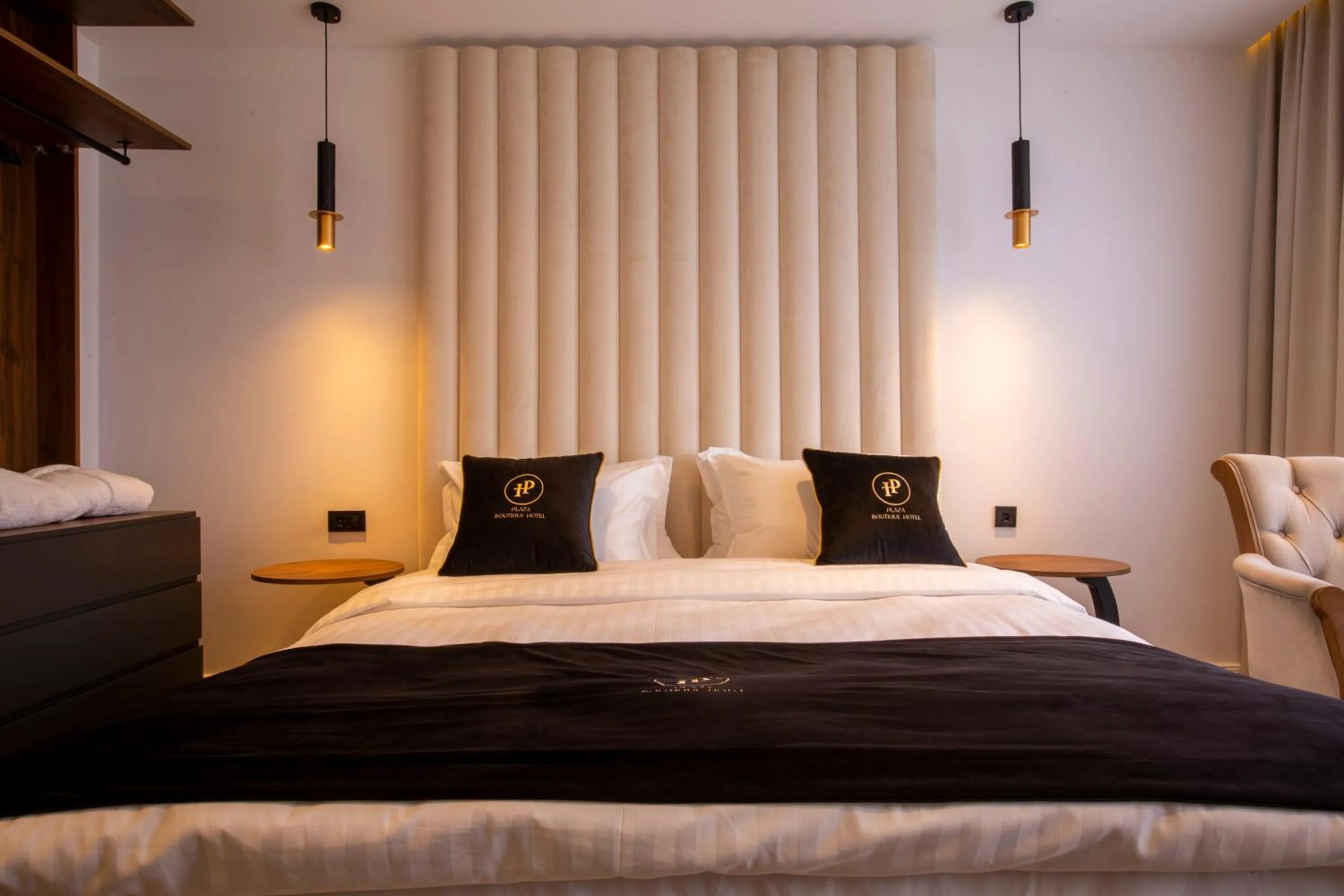 Bed in Plaza Boutique Hotel