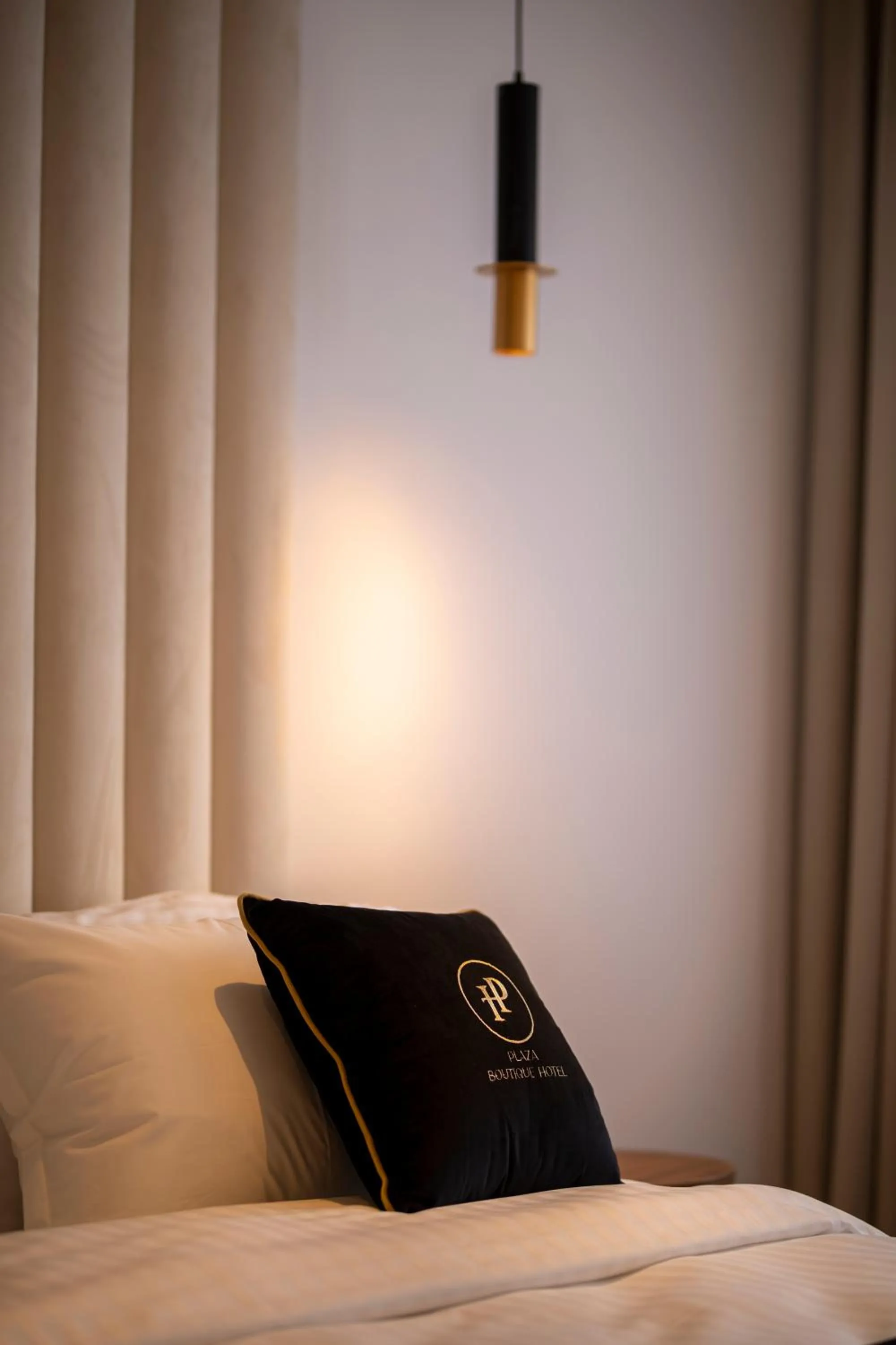 Bed in Plaza Boutique Hotel