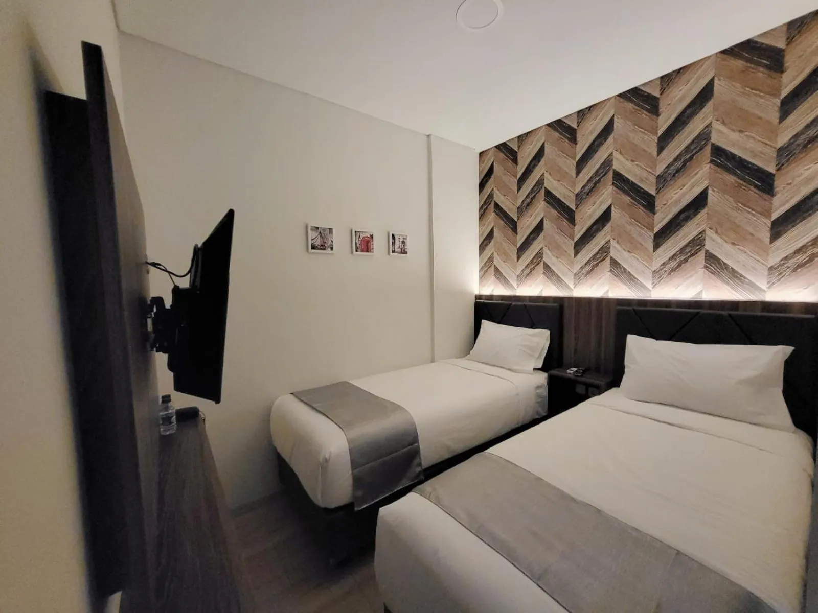 Bed in Grand Plaza Boutique Hotel