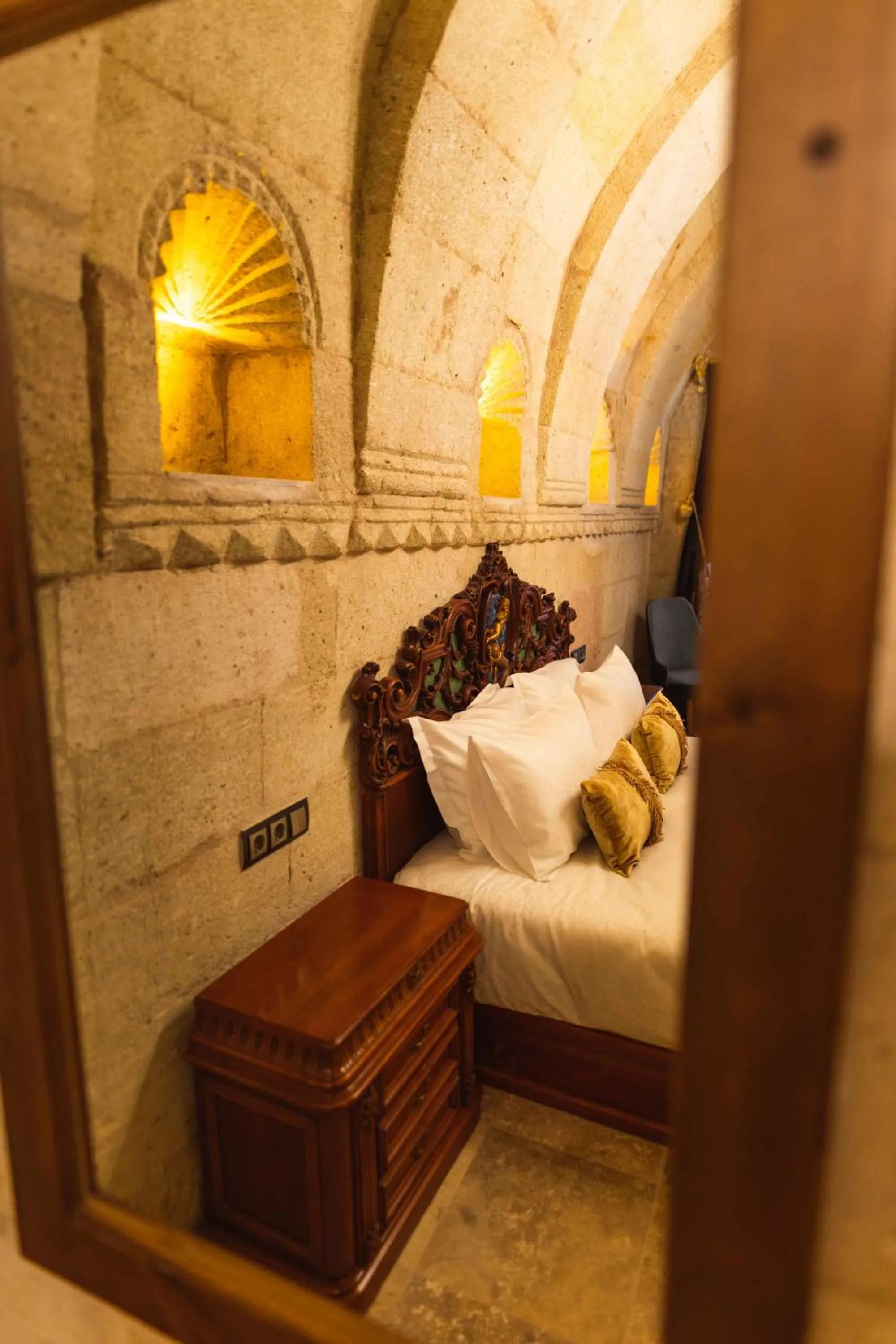 Bed in Solo Cave Suites