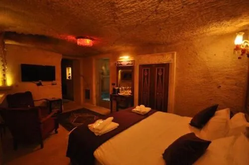 Bed in Solo Cave Suites