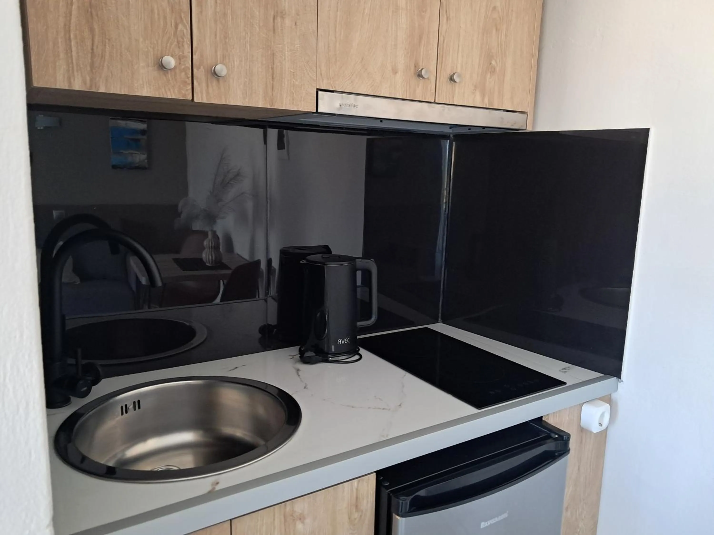 Kitchen or kitchenette in Secret Garden Hotel