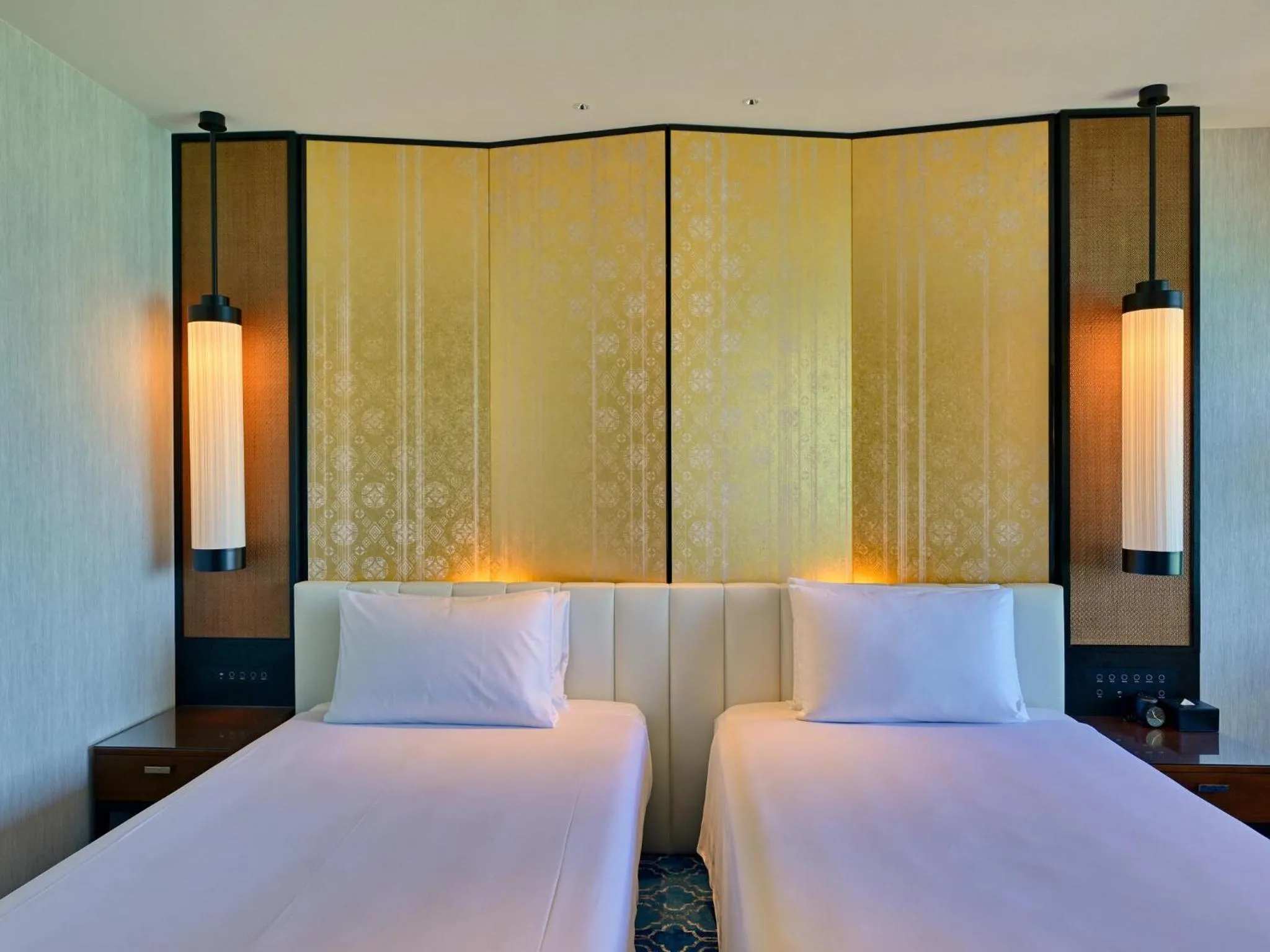 Bed in Ryukyu Hotel & Resort Nashiro Beach