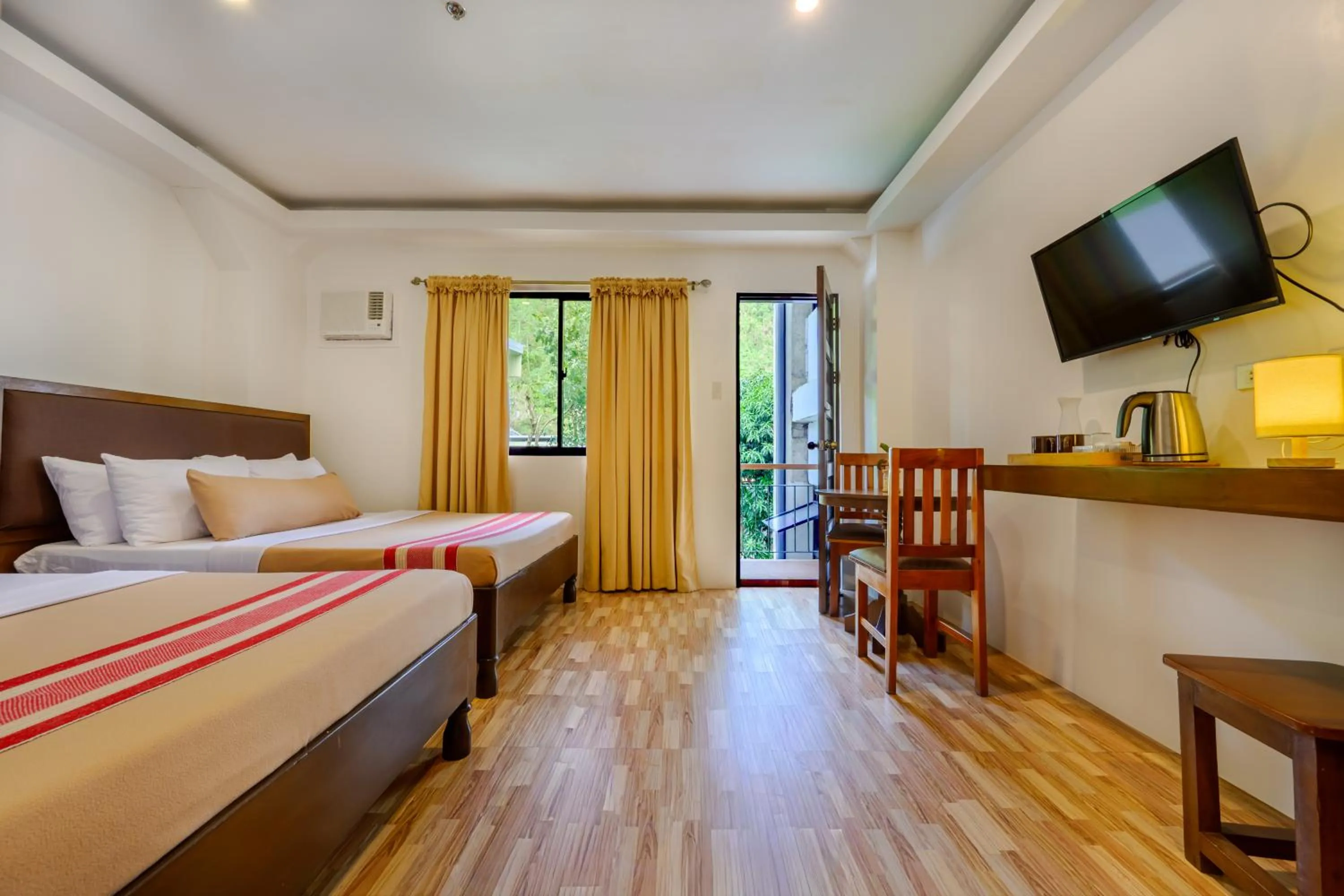 Bed in Jurias Garden Hotel