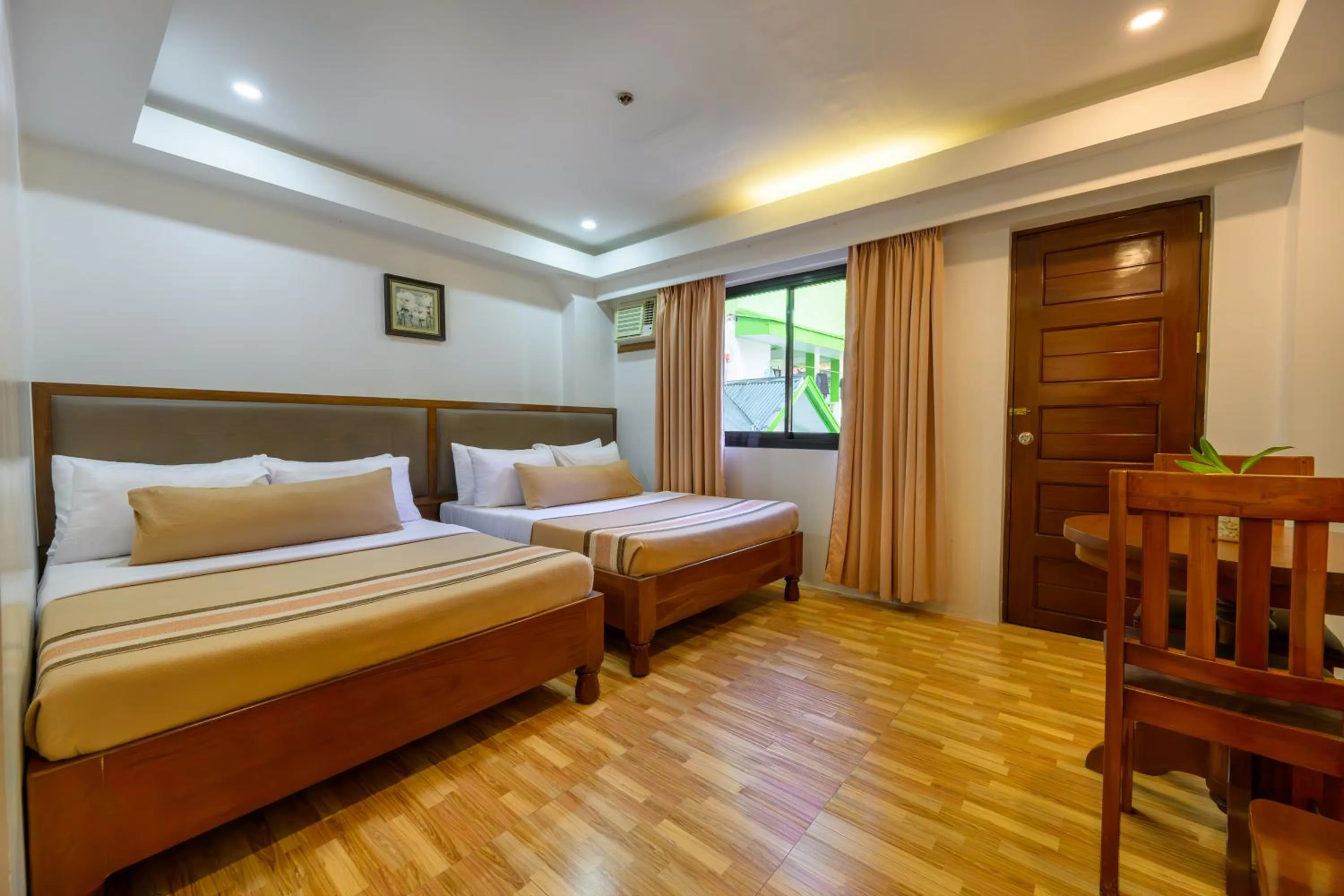 Bed in Jurias Garden Hotel