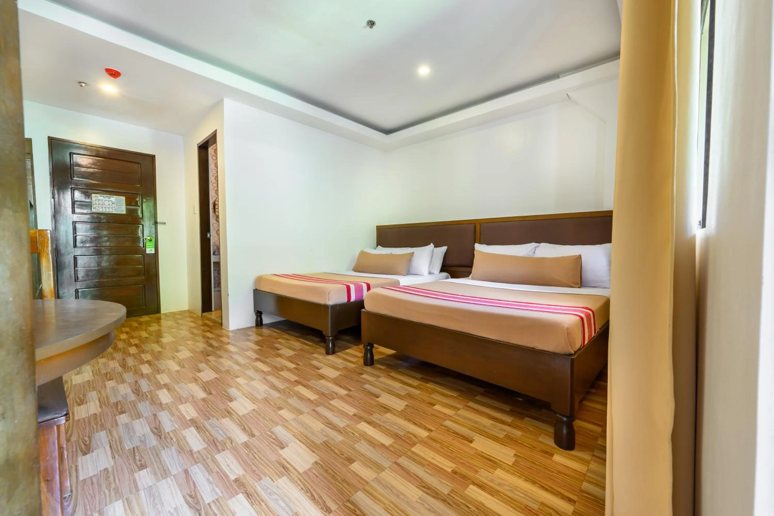 Bed in Jurias Garden Hotel