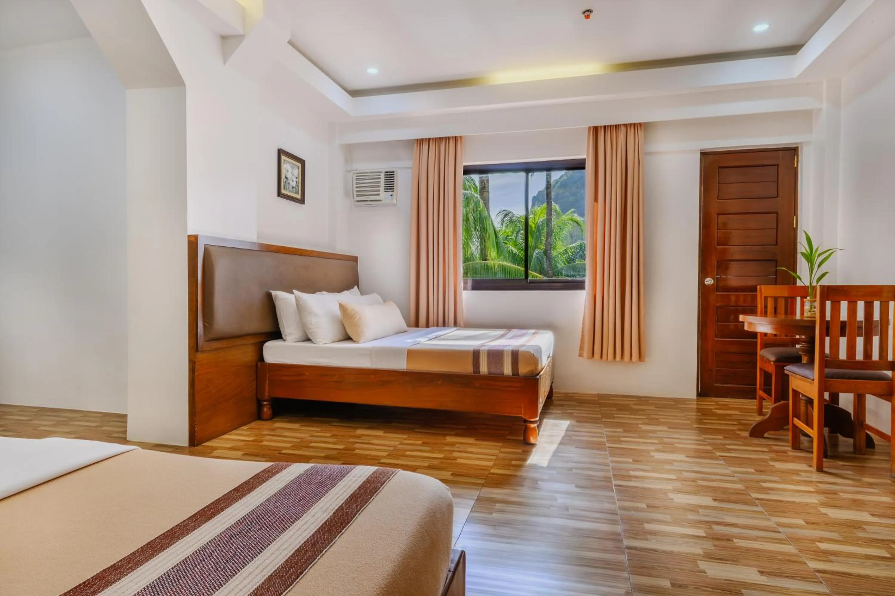 Bed in Jurias Garden Hotel