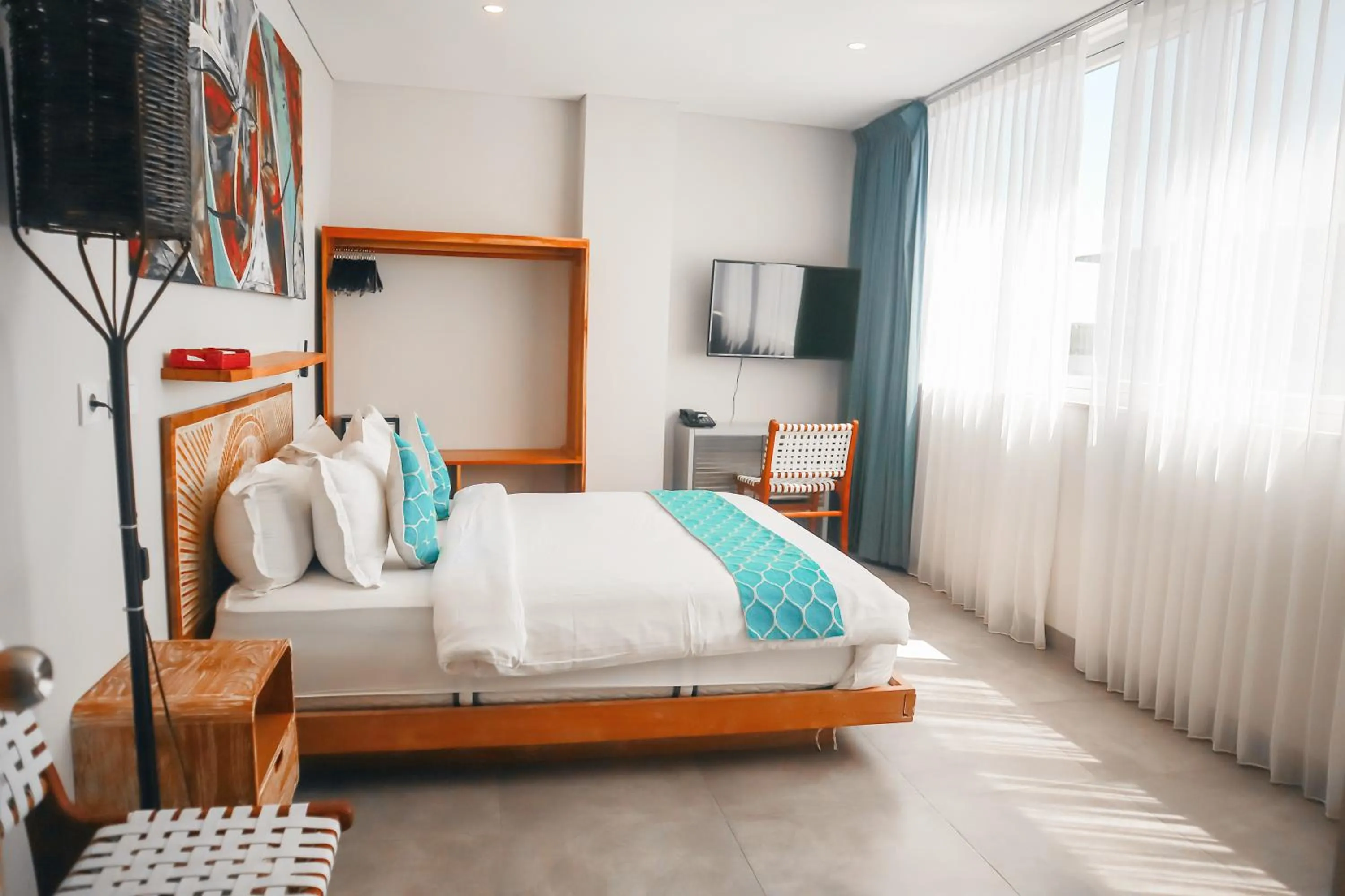 Communal lounge/ TV room, Bed in Harbour Komodo Hotel