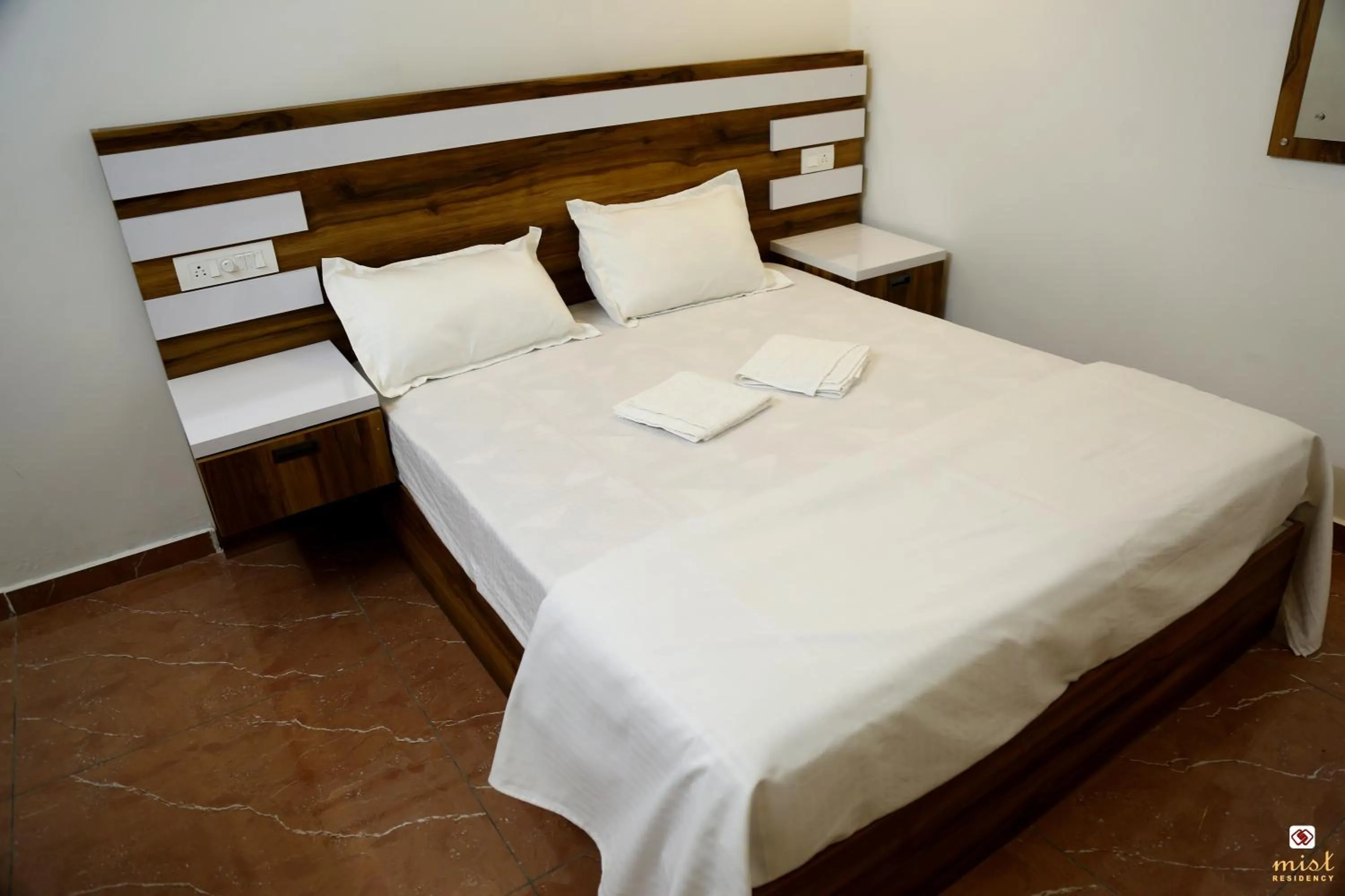 Bed in MIST RESIDENCY