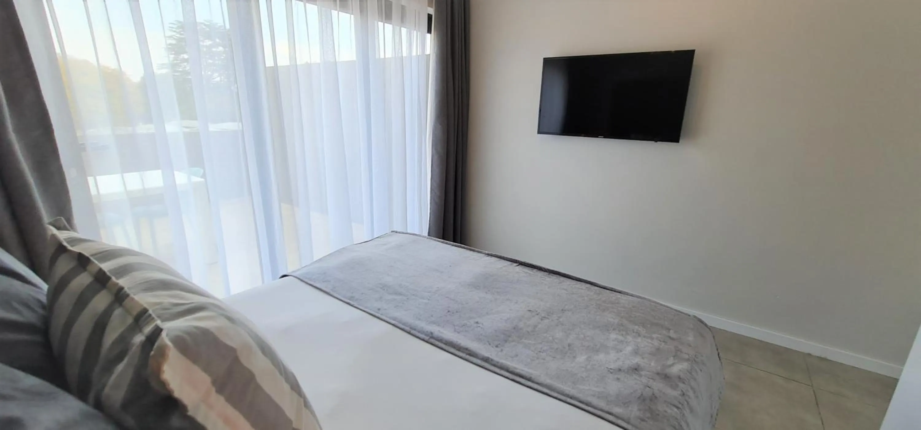 Bed in MINT Apartments Greenside