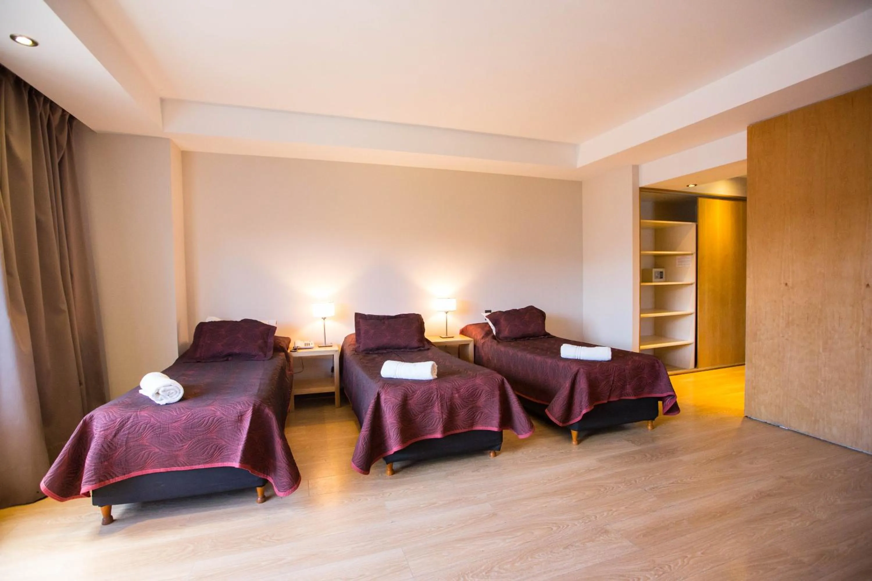 Photo of the whole room, Bed in Hotel Bariloche Suites