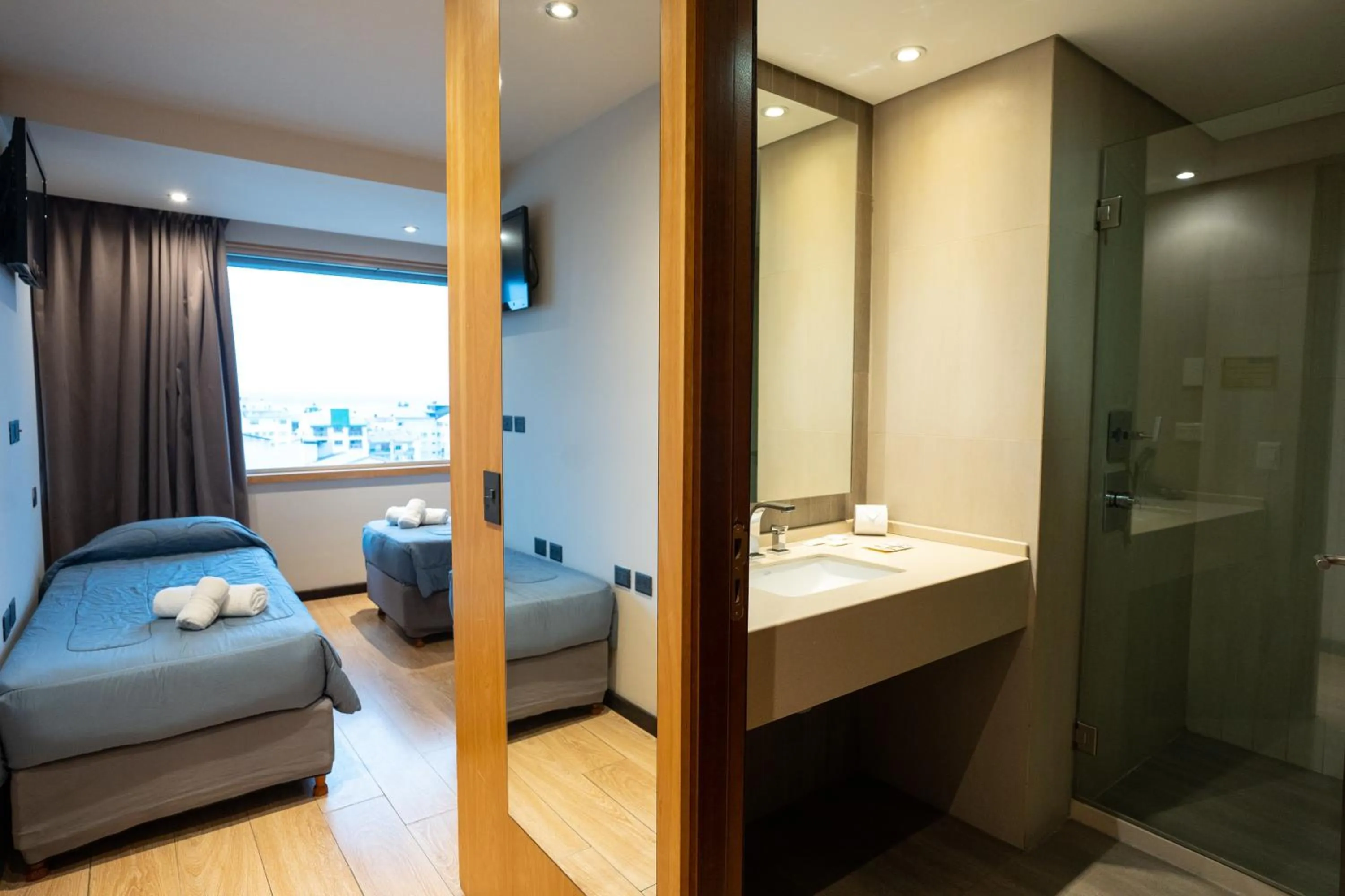 Bed in Hotel Bariloche Suites