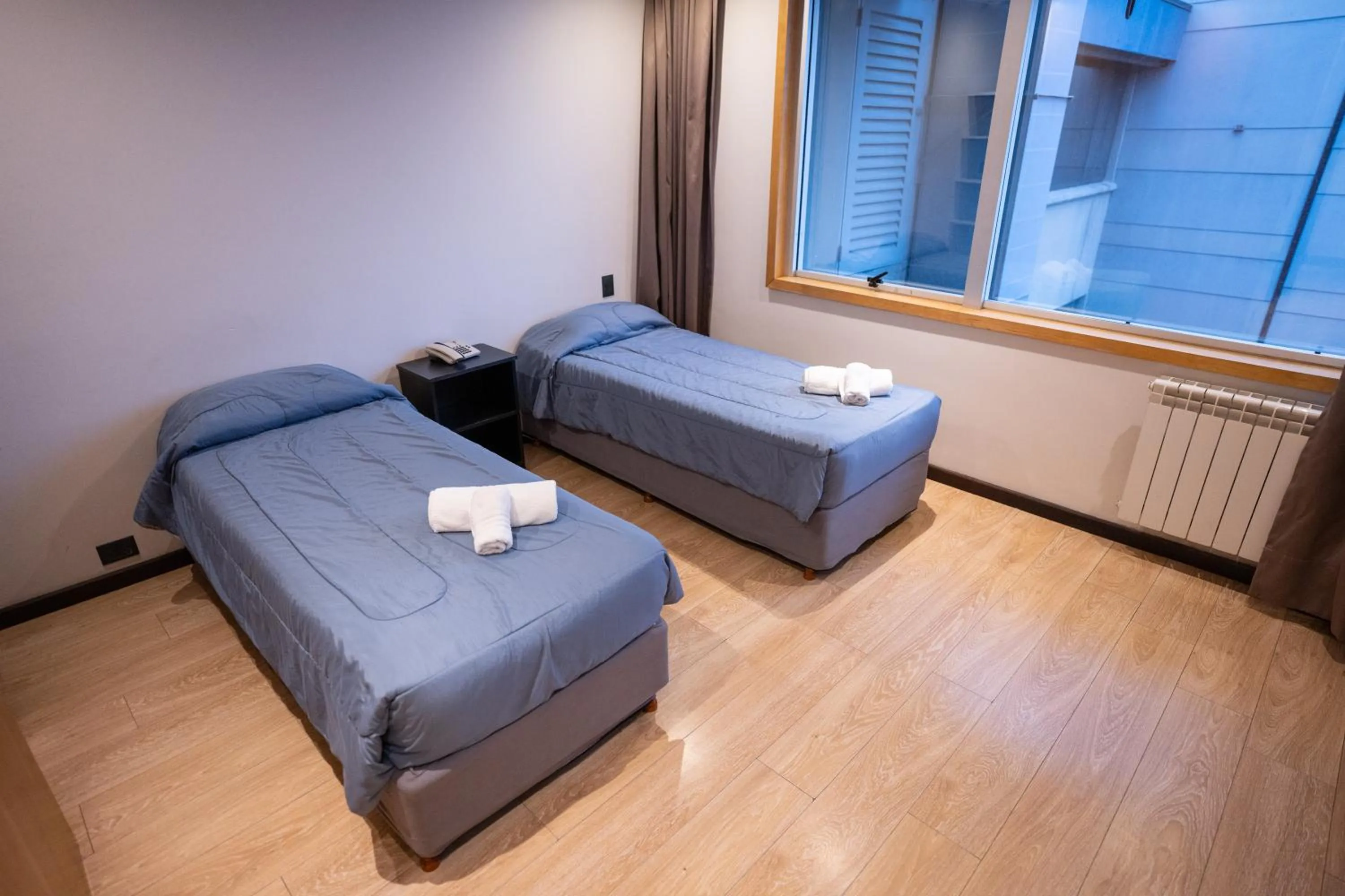 Bed in Hotel Bariloche Suites