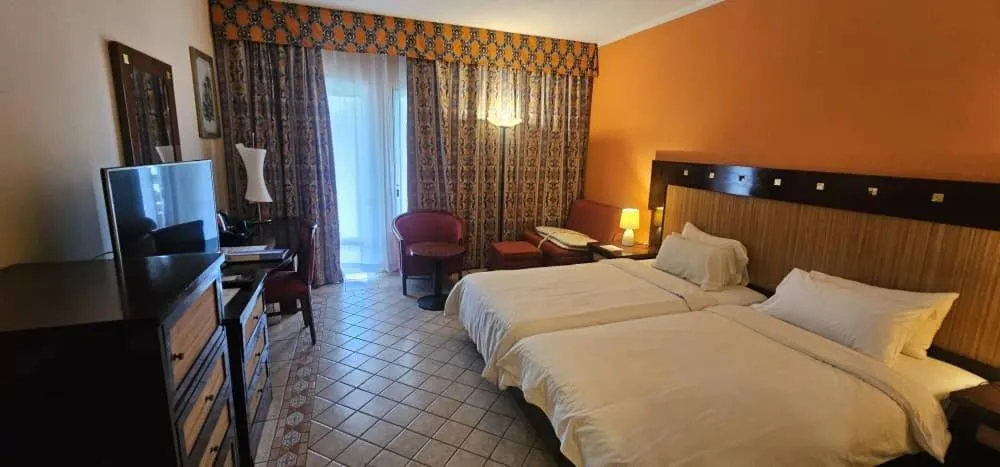 Bed in The Kairaba Beach Hotel