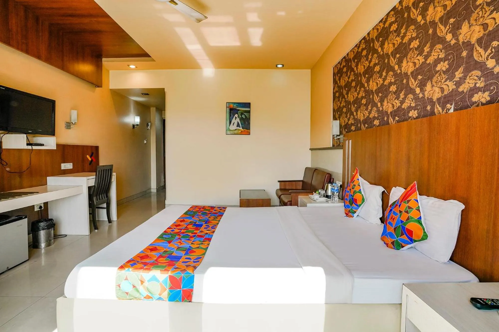 Bed in FabHotel Devanshi Inn