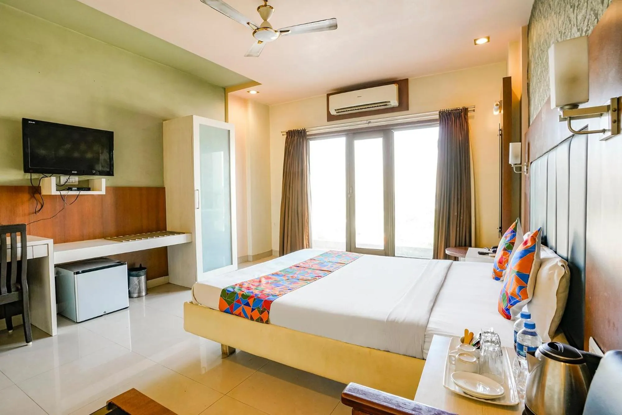 Bed in FabHotel Devanshi Inn