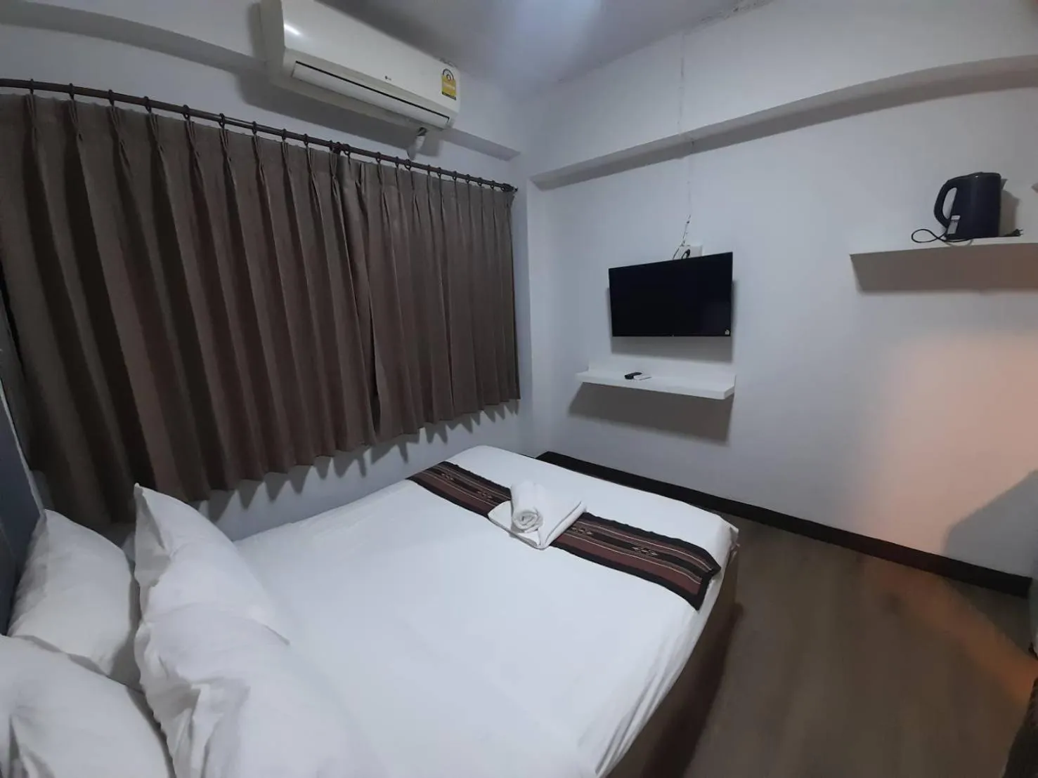 Bed in Home Place Hotel