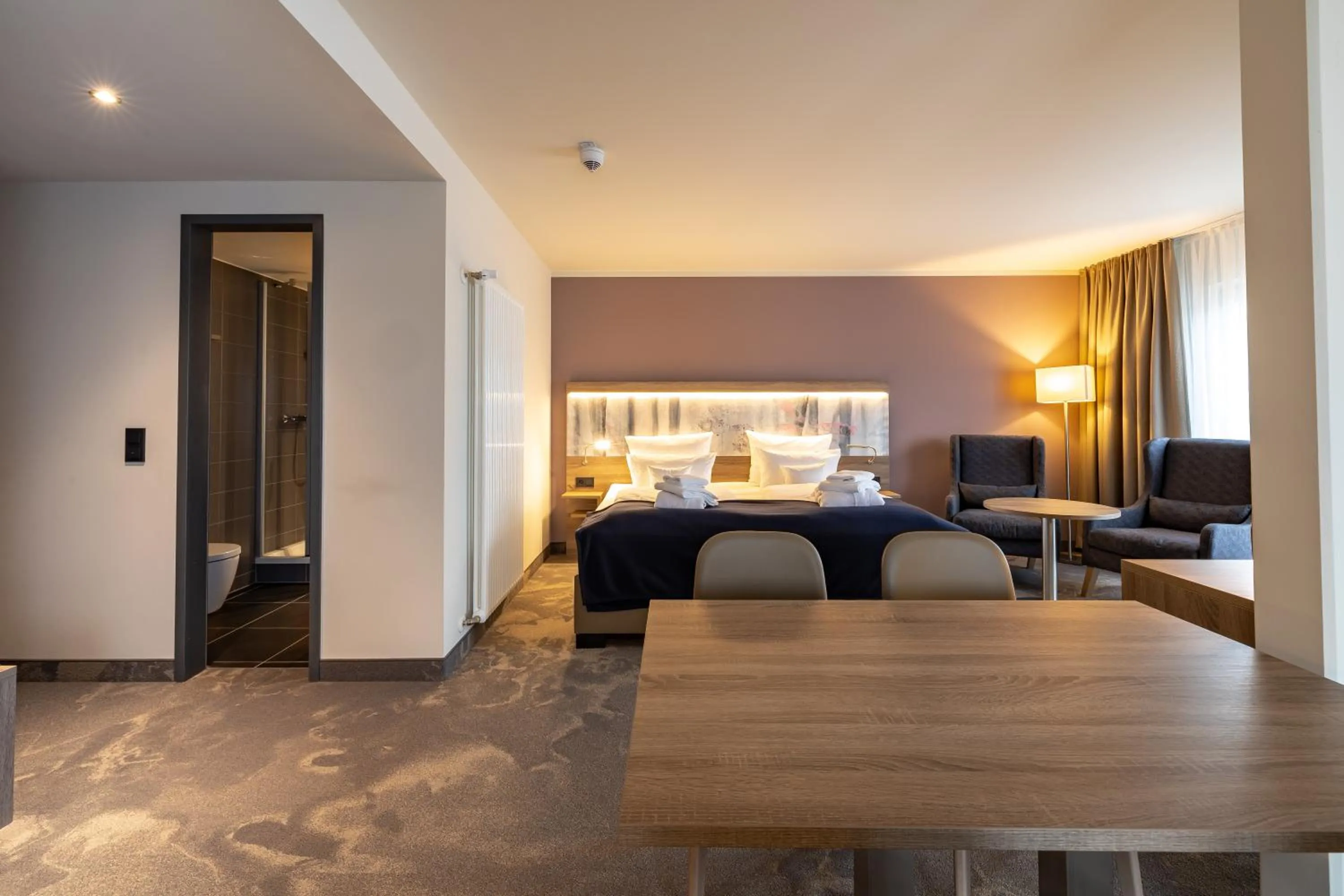 Living room, Bed in Santé Royale Rügen Resort