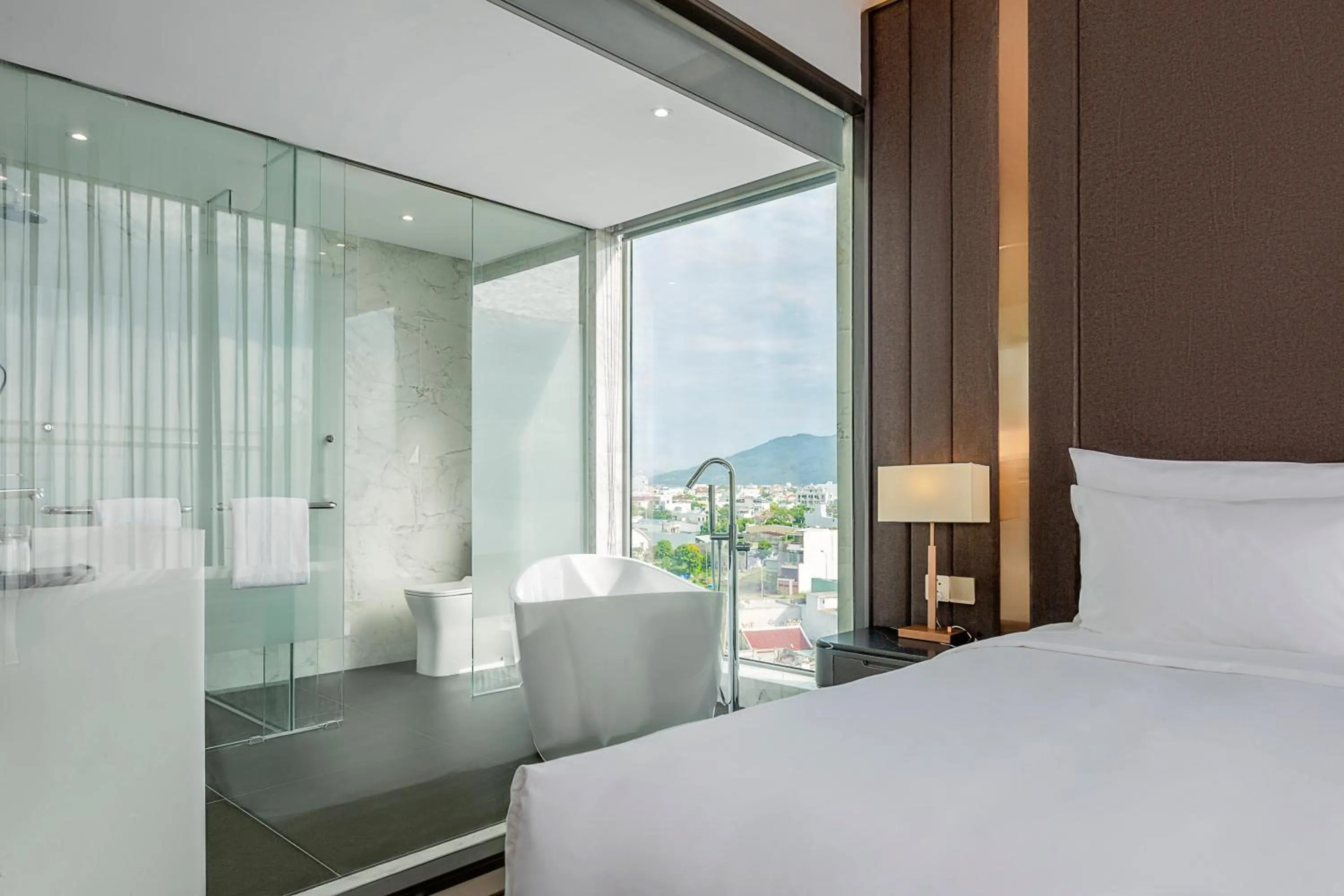 Bathroom, Bed in Le Sands Oceanfront Danang Hotel