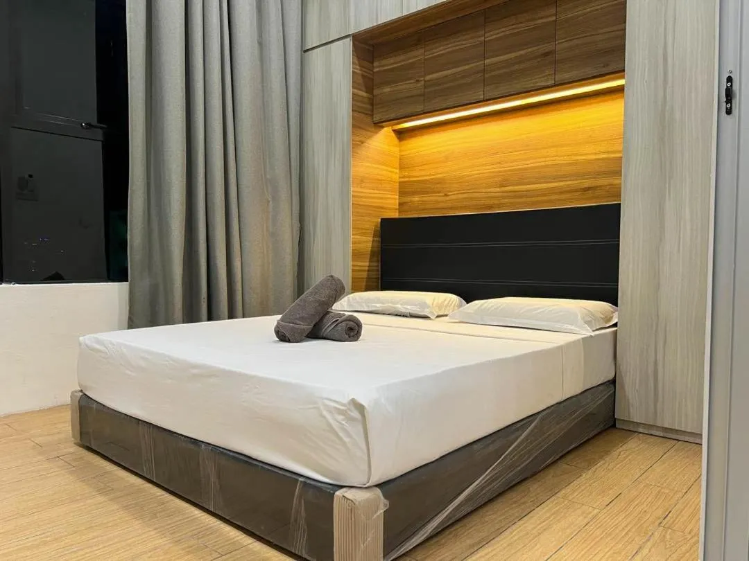 Bed in Hush Inn at ITCC Manhattan Suites