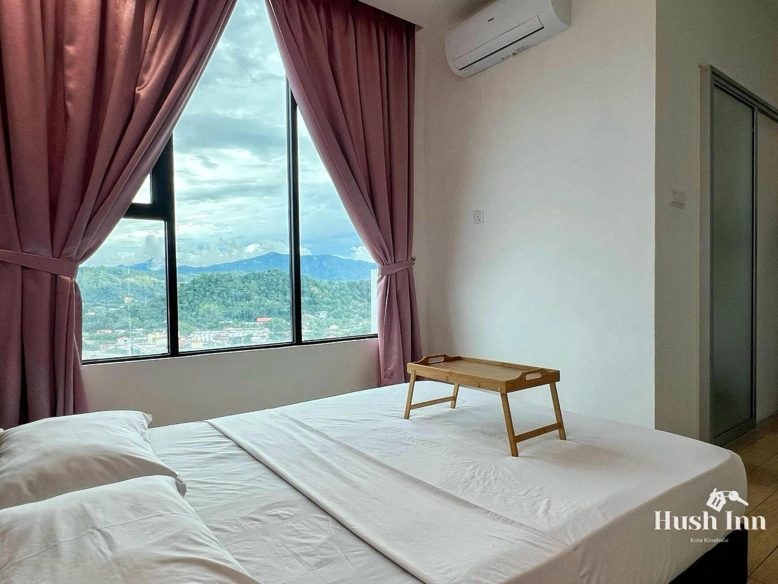 Bed in Hush Inn at ITCC Manhattan Suites