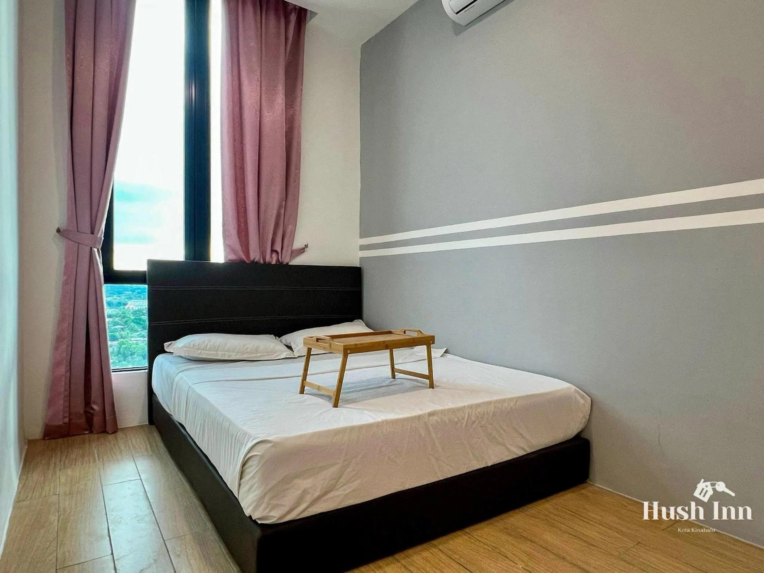 Bed in Hush Inn at ITCC Manhattan Suites