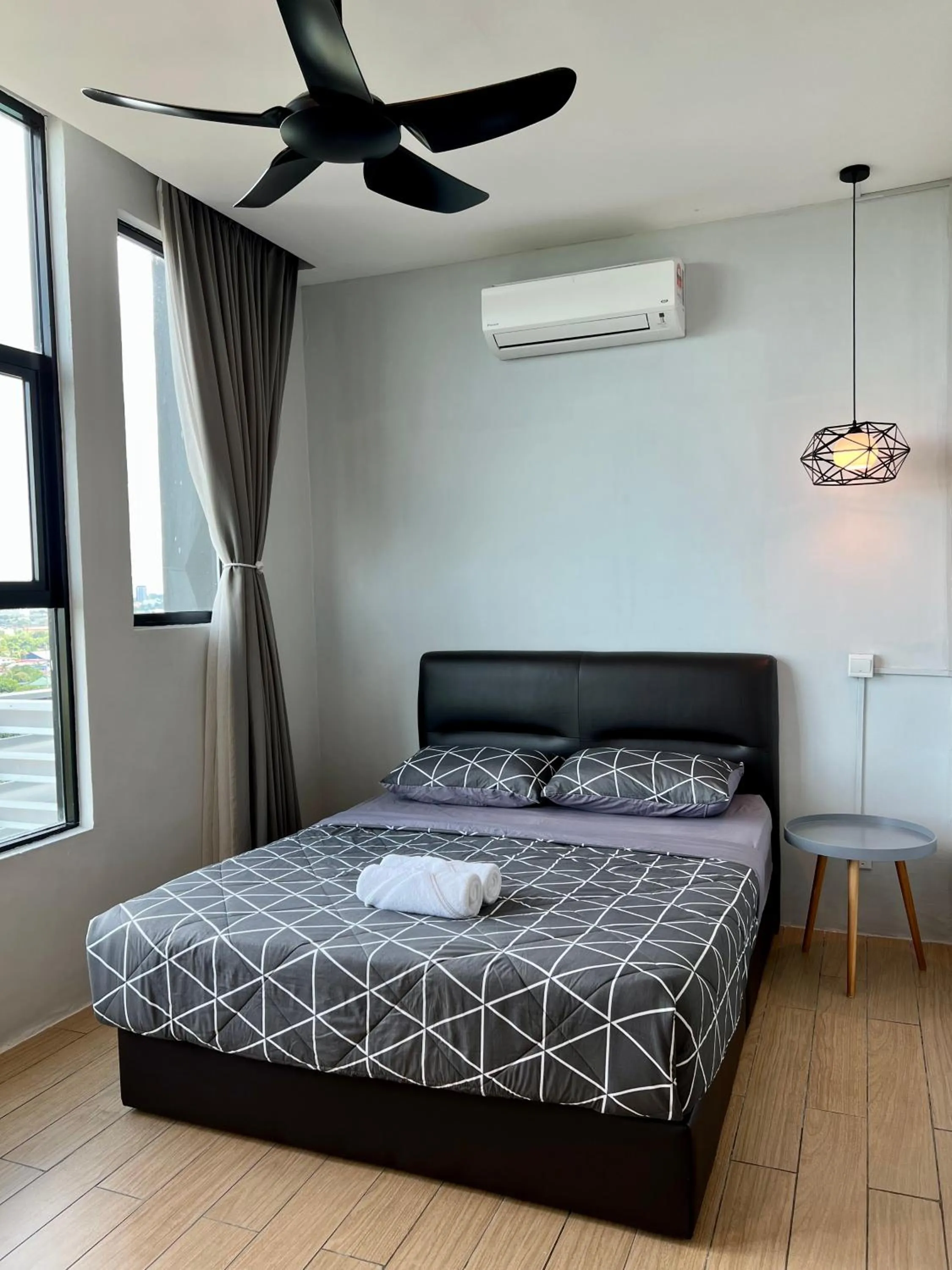 Bed in Hush Inn at ITCC Manhattan Suites