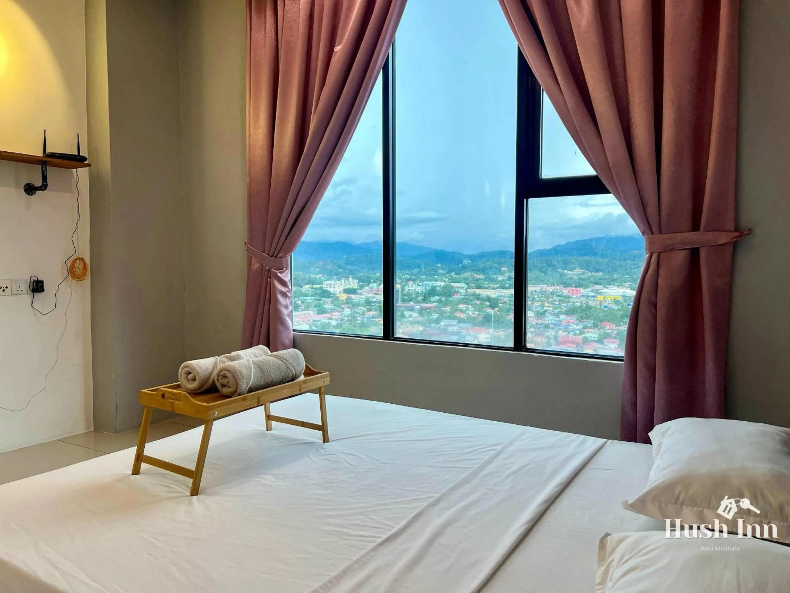 Bed in Hush Inn at ITCC Manhattan Suites