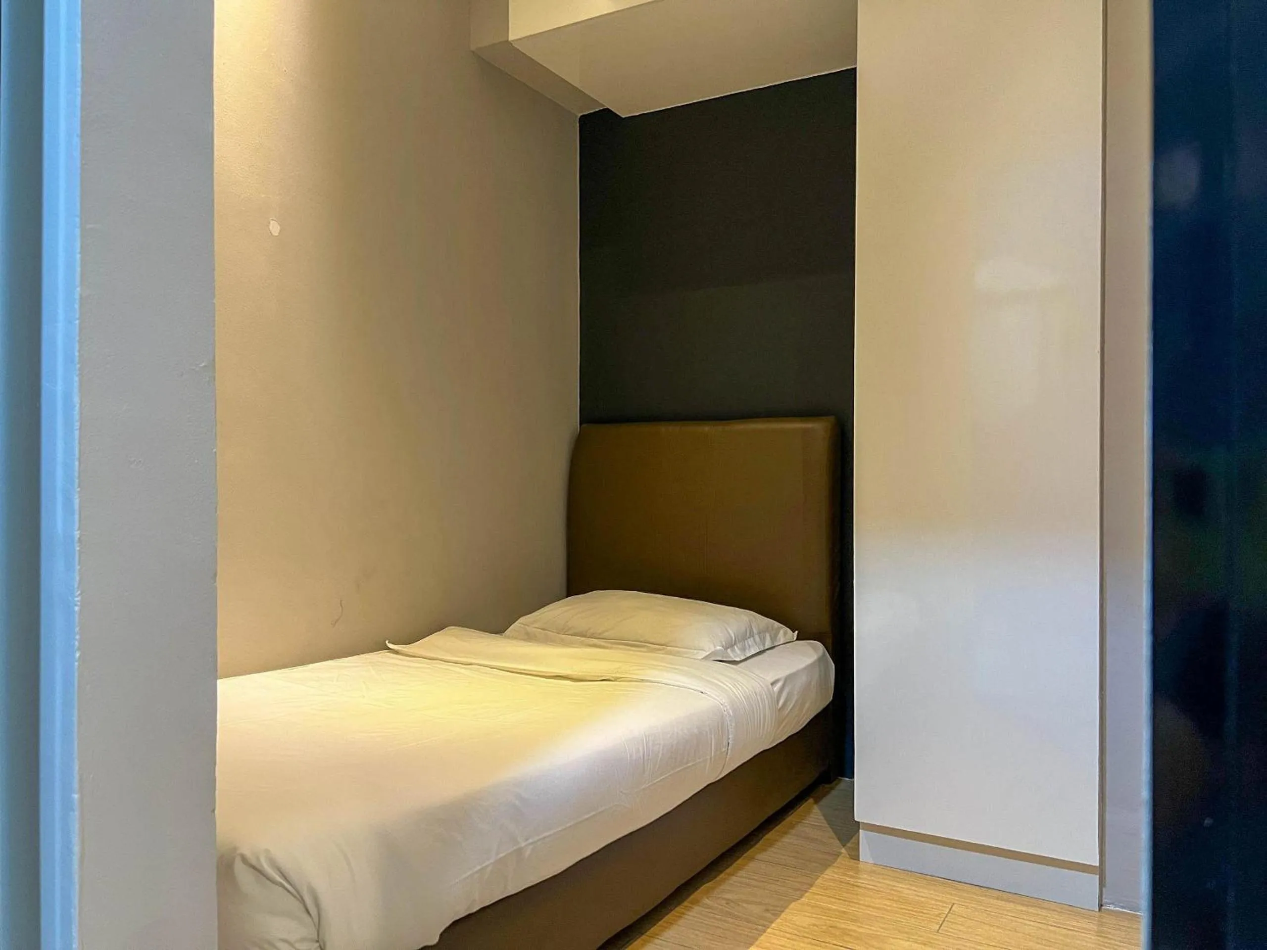 Bed in Hush Inn at ITCC Manhattan Suites