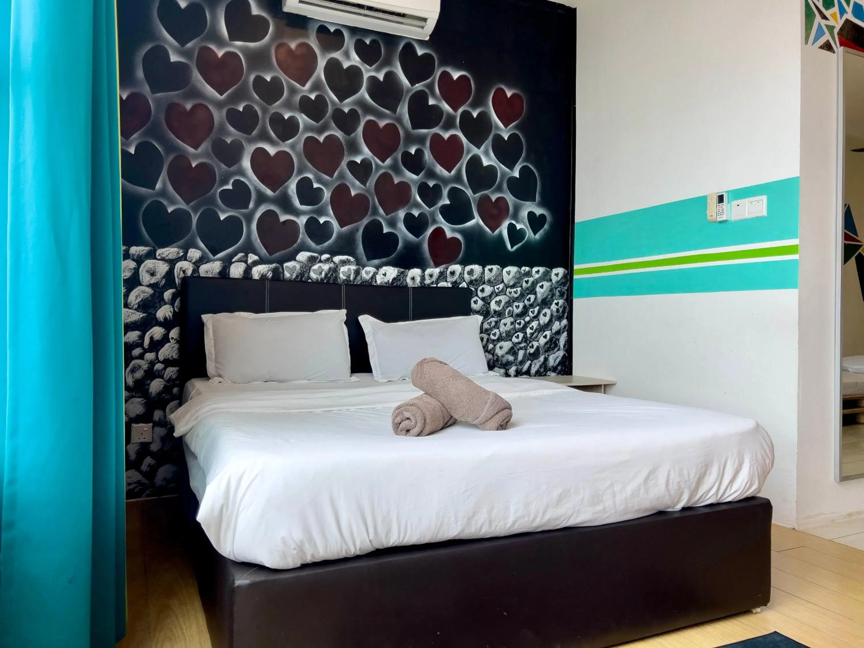 Bed in Hush Inn at ITCC Manhattan Suites