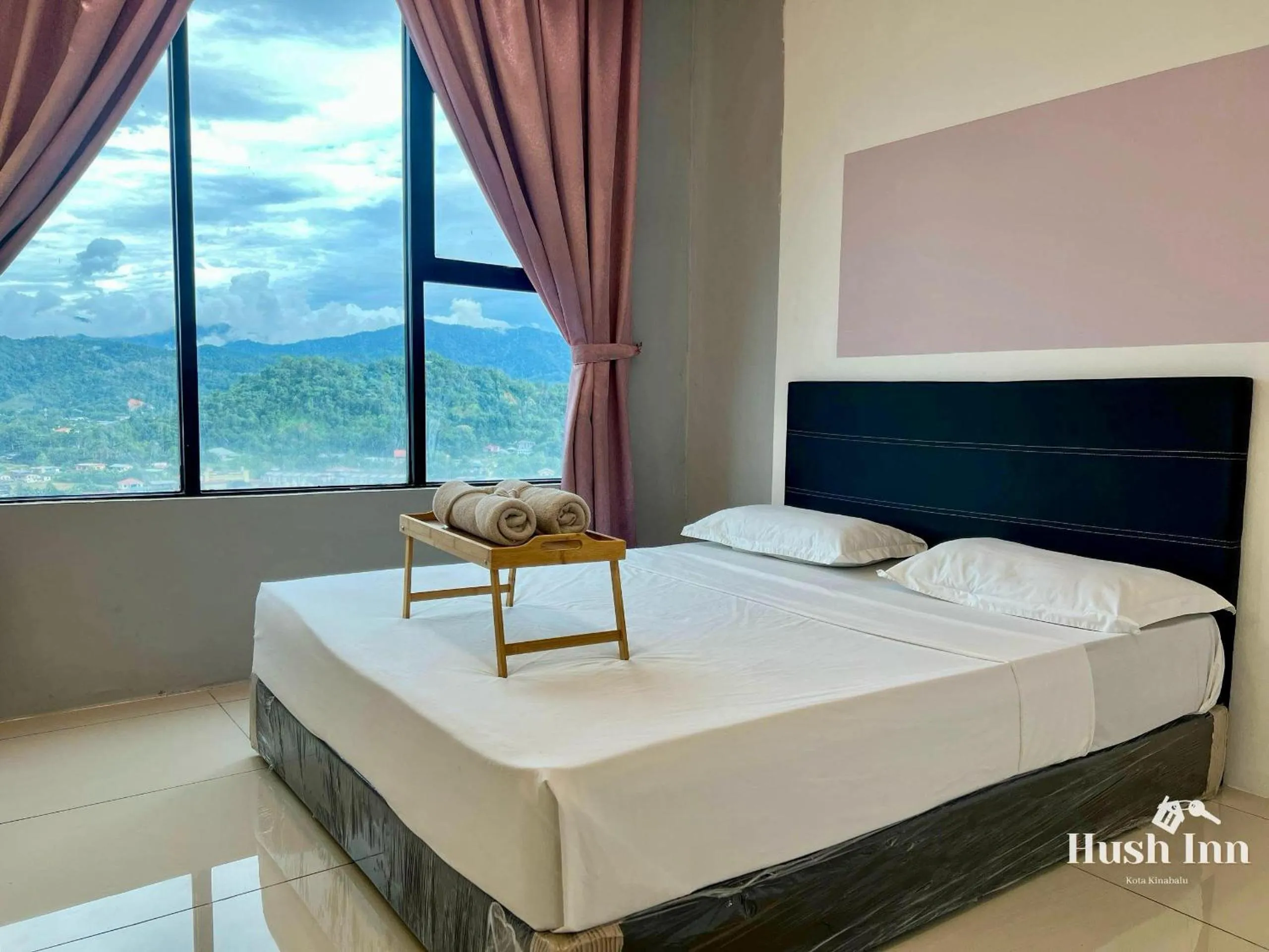 Bed in Hush Inn at ITCC Manhattan Suites