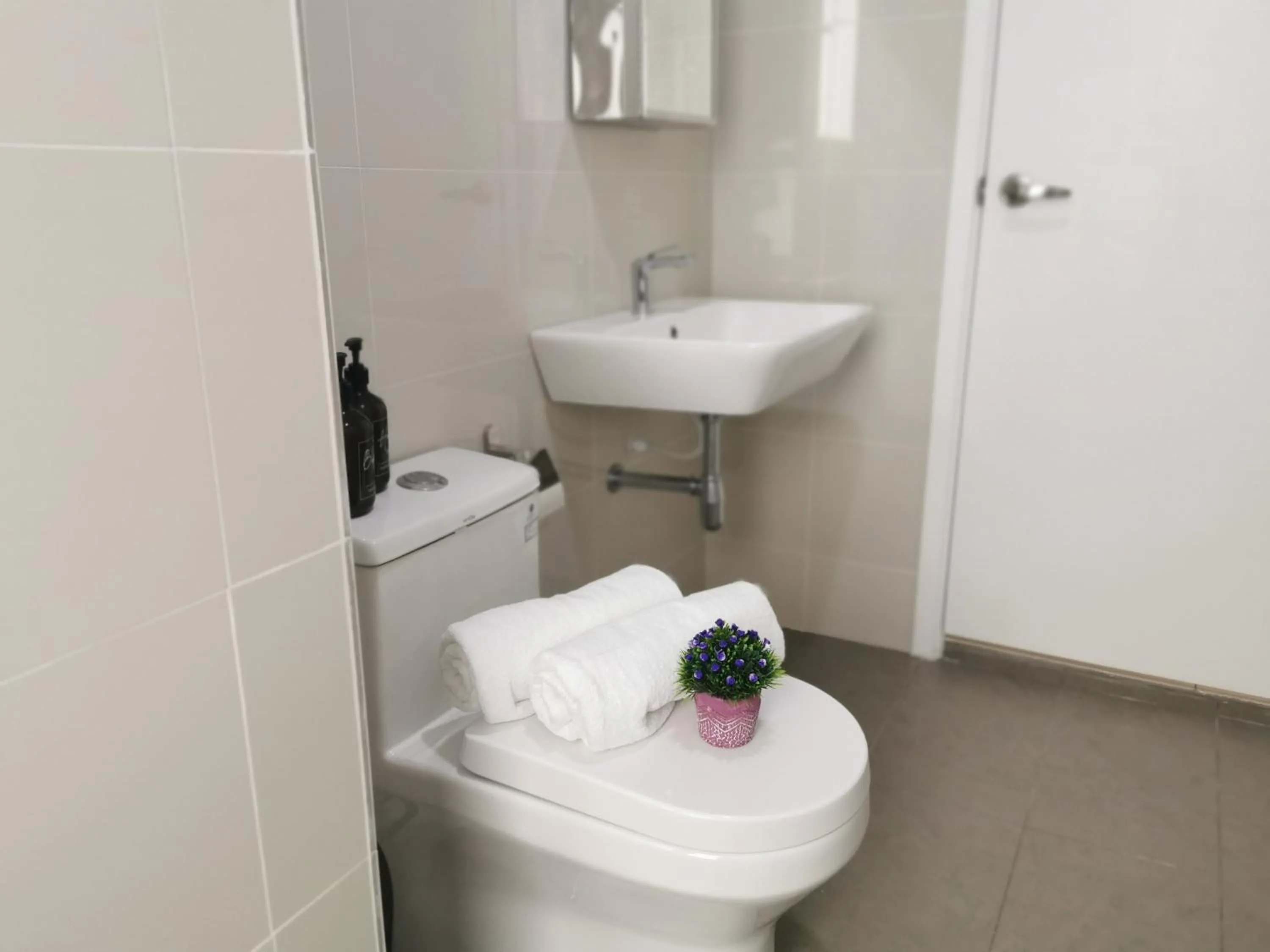 Toilet in Continew Residence by HomeBrickz