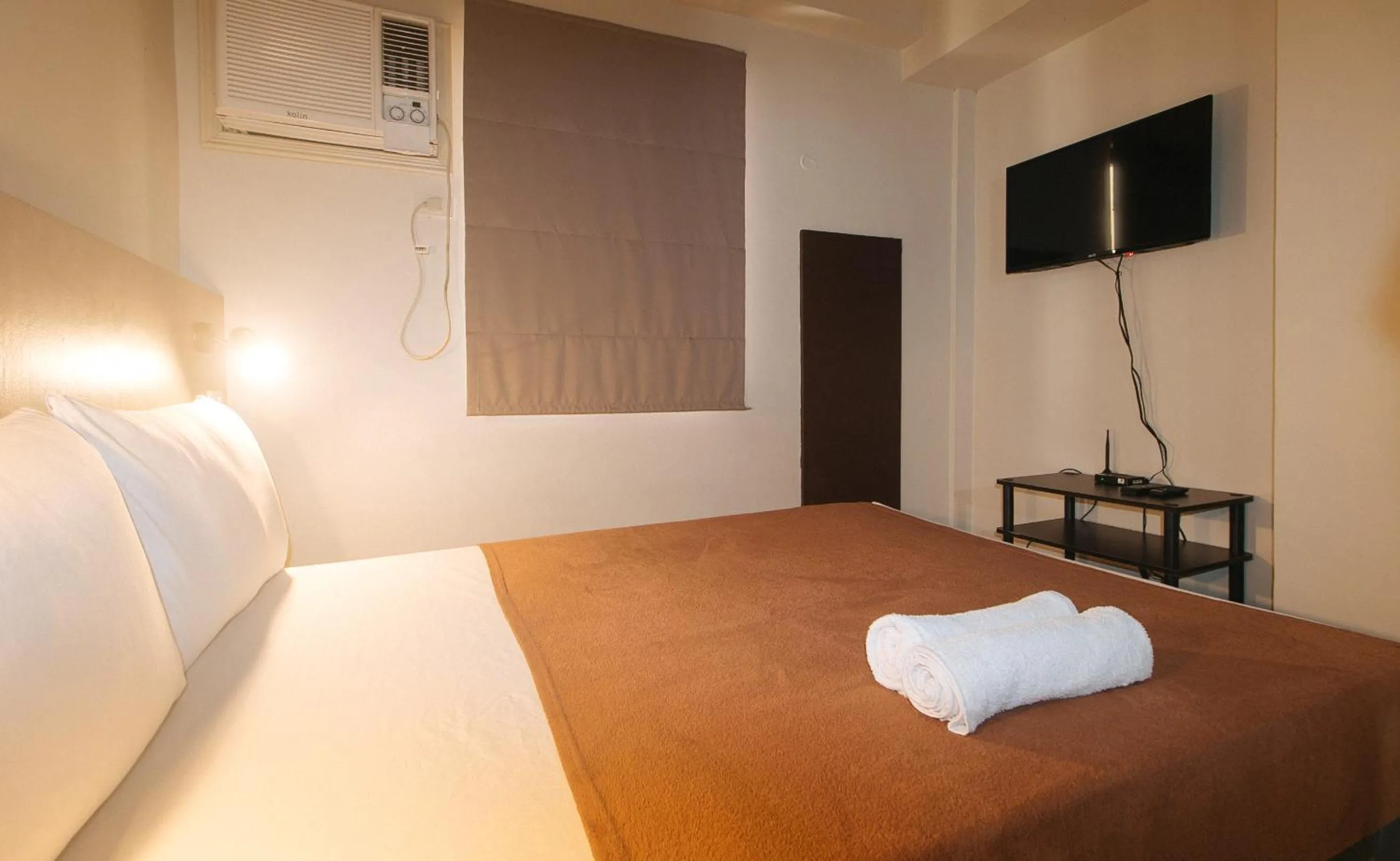 Bed in 59 Xavierville by RedDoorz