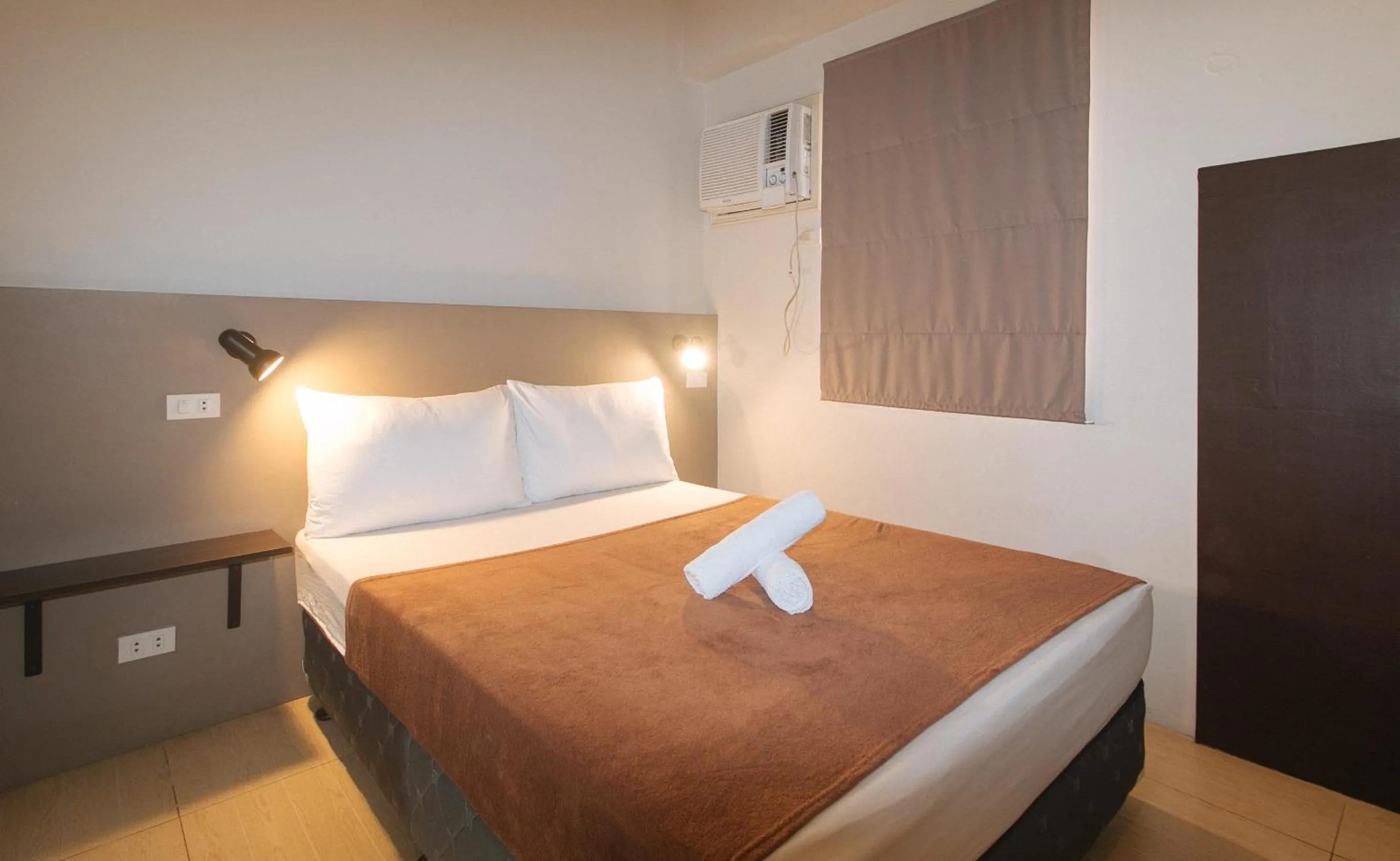 Bed in 59 Xavierville by RedDoorz